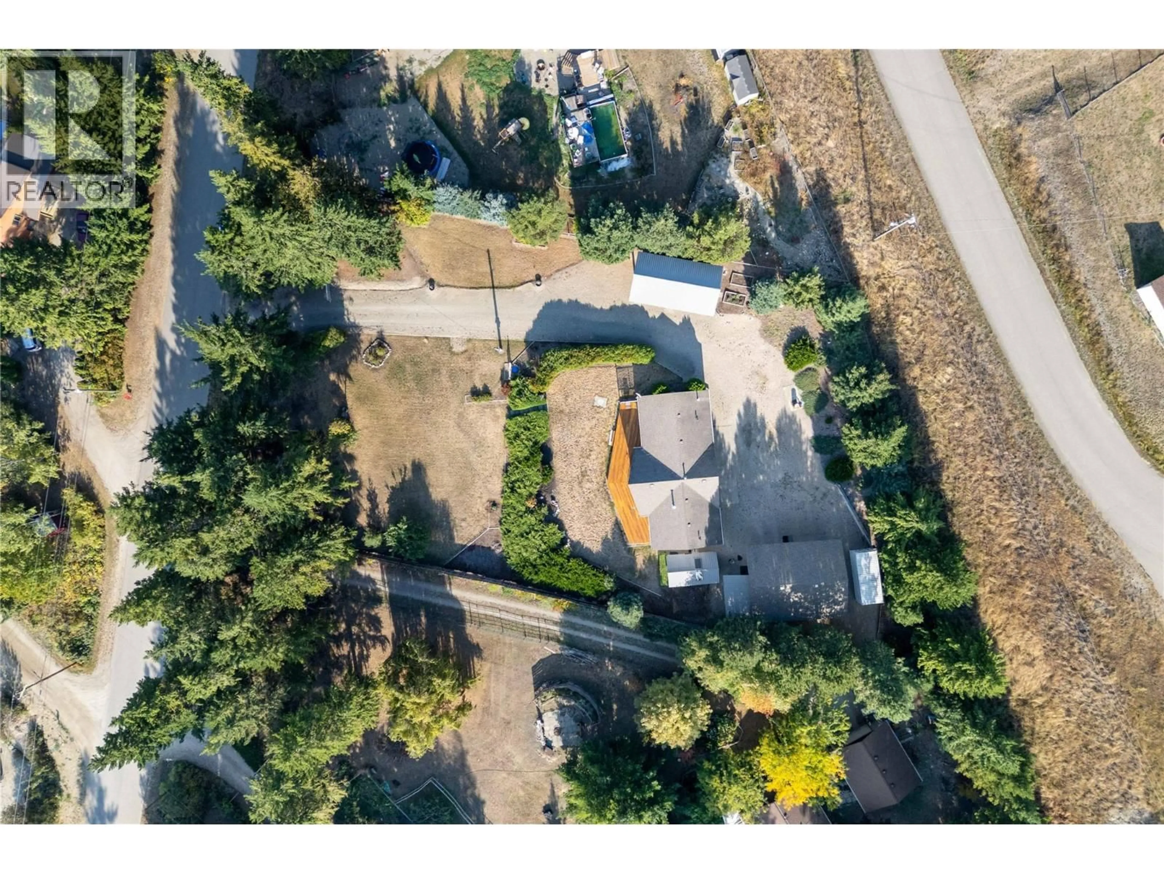 A pic from outside/outdoor area/front of a property/back of a property/a pic from drone, street for 760 MOBLEY ROAD, Tappen British Columbia V0E2X1