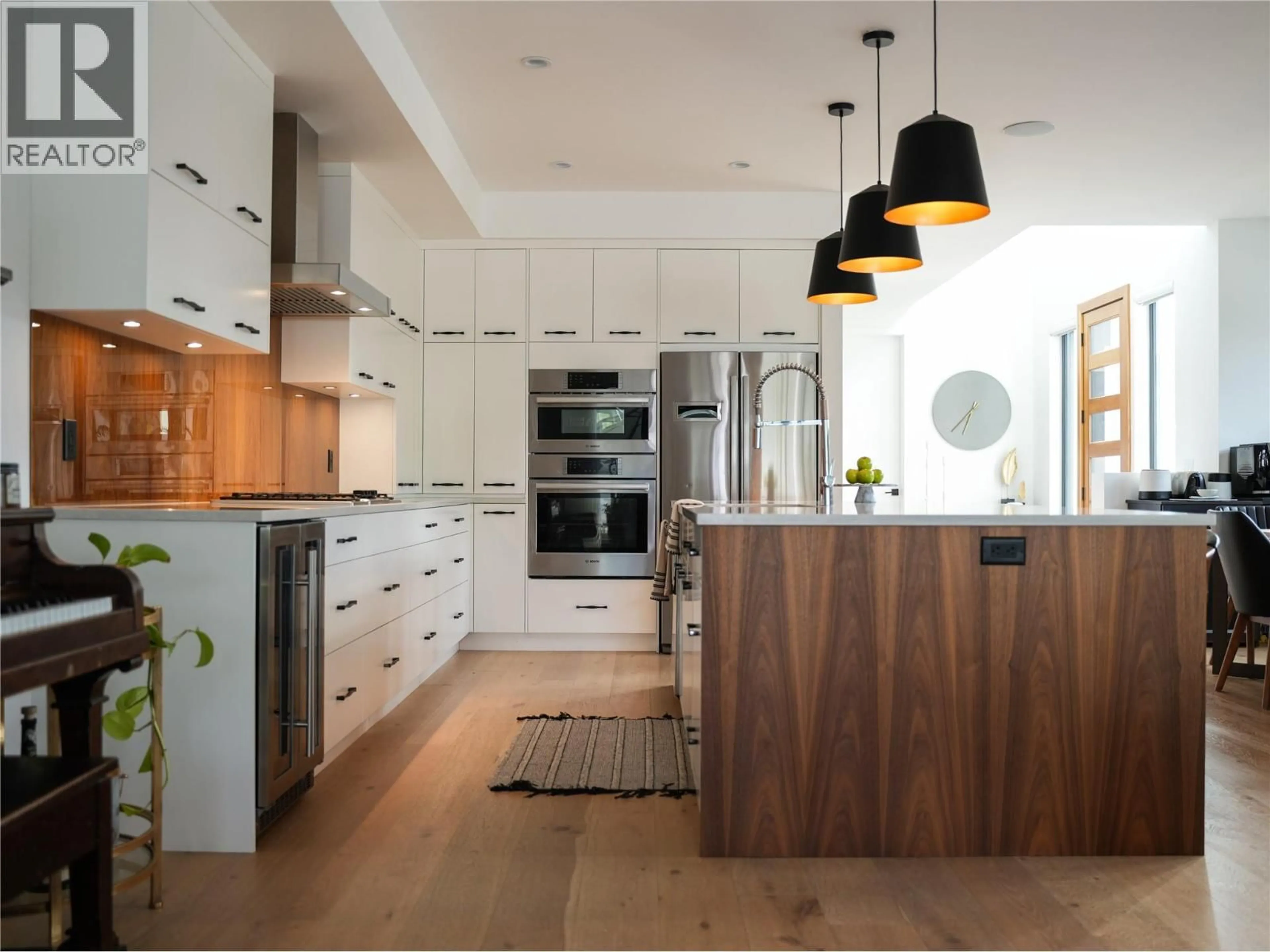 Contemporary kitchen, wood/laminate floor for 610 BARRERA ROAD, Kelowna British Columbia V1W3K2