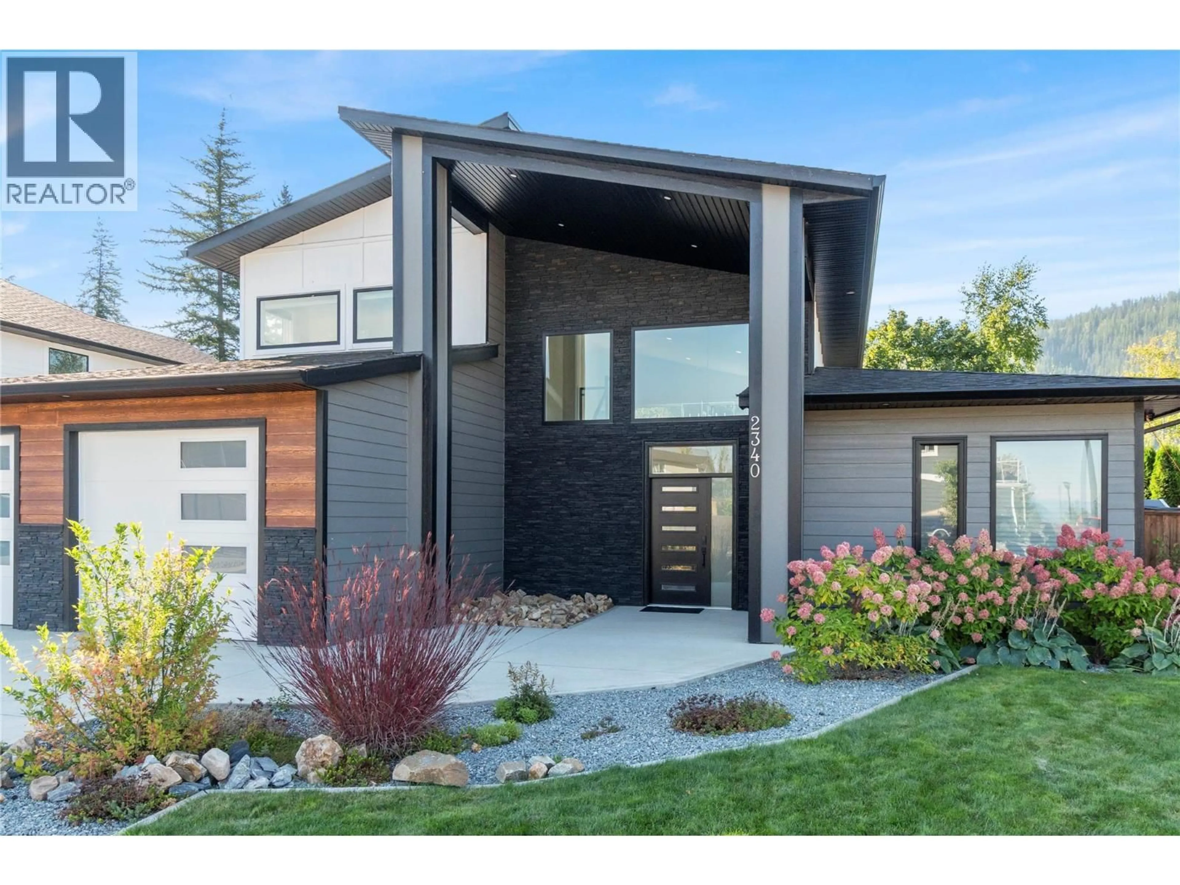 Home with vinyl exterior material, street for 2340 15 AVENUE SOUTHEAST, Salmon Arm British Columbia V1E0E7