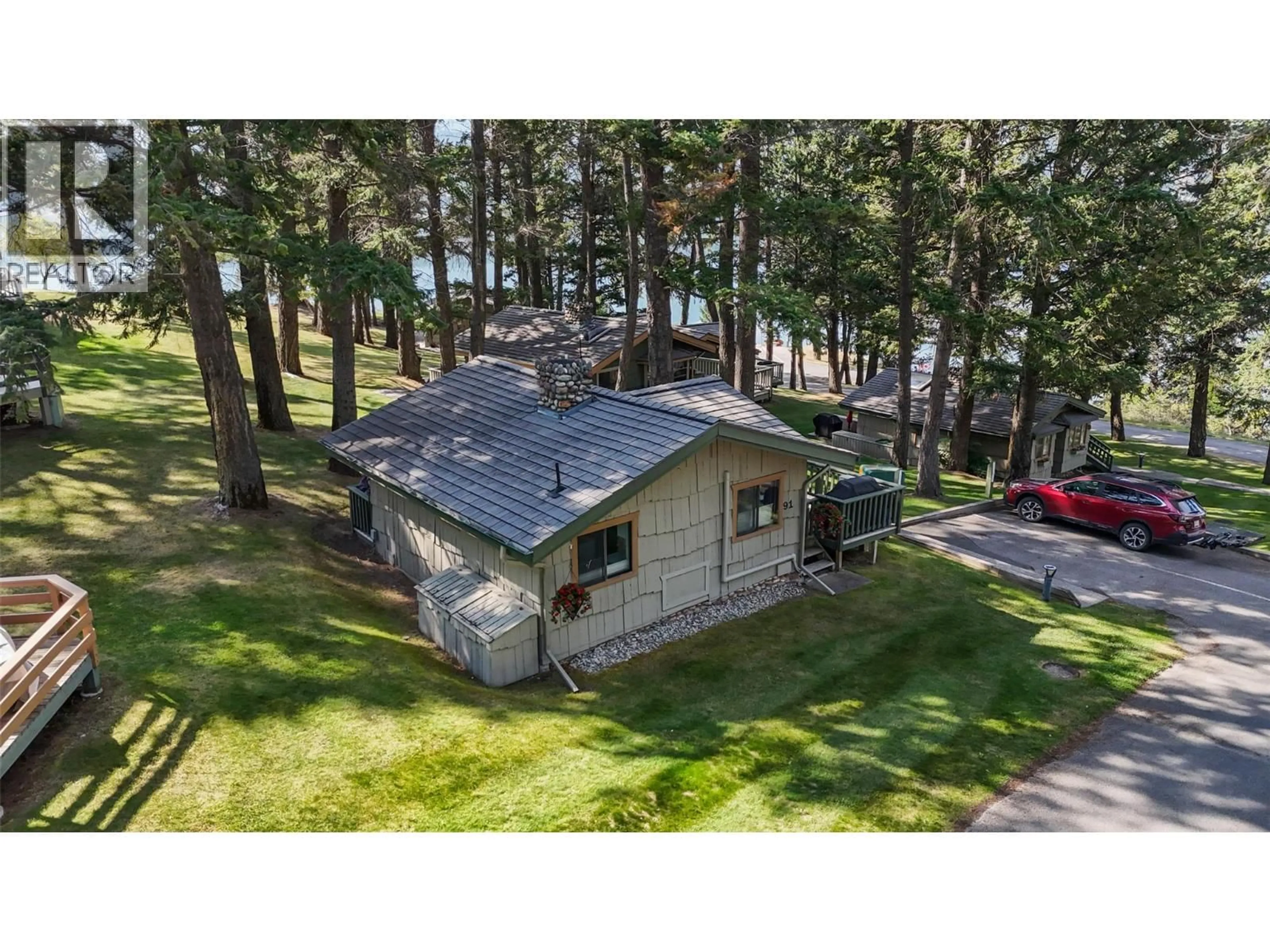 A pic from outside/outdoor area/front of a property/back of a property/a pic from drone, forest/trees view for 91 - 1492 AKISKINOOK ROAD, Windermere British Columbia V0B2L1