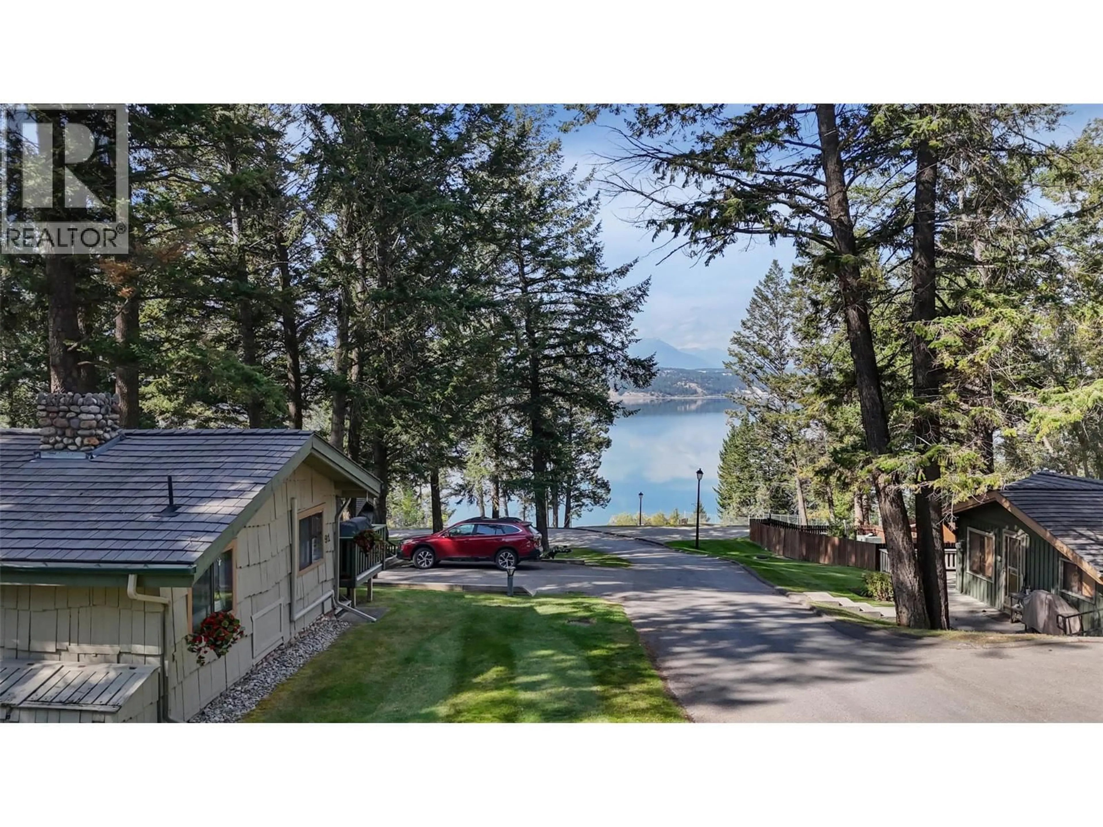 A pic from outside/outdoor area/front of a property/back of a property/a pic from drone, water/lake/river/ocean view for 91 - 1492 AKISKINOOK ROAD, Windermere British Columbia V0B2L1