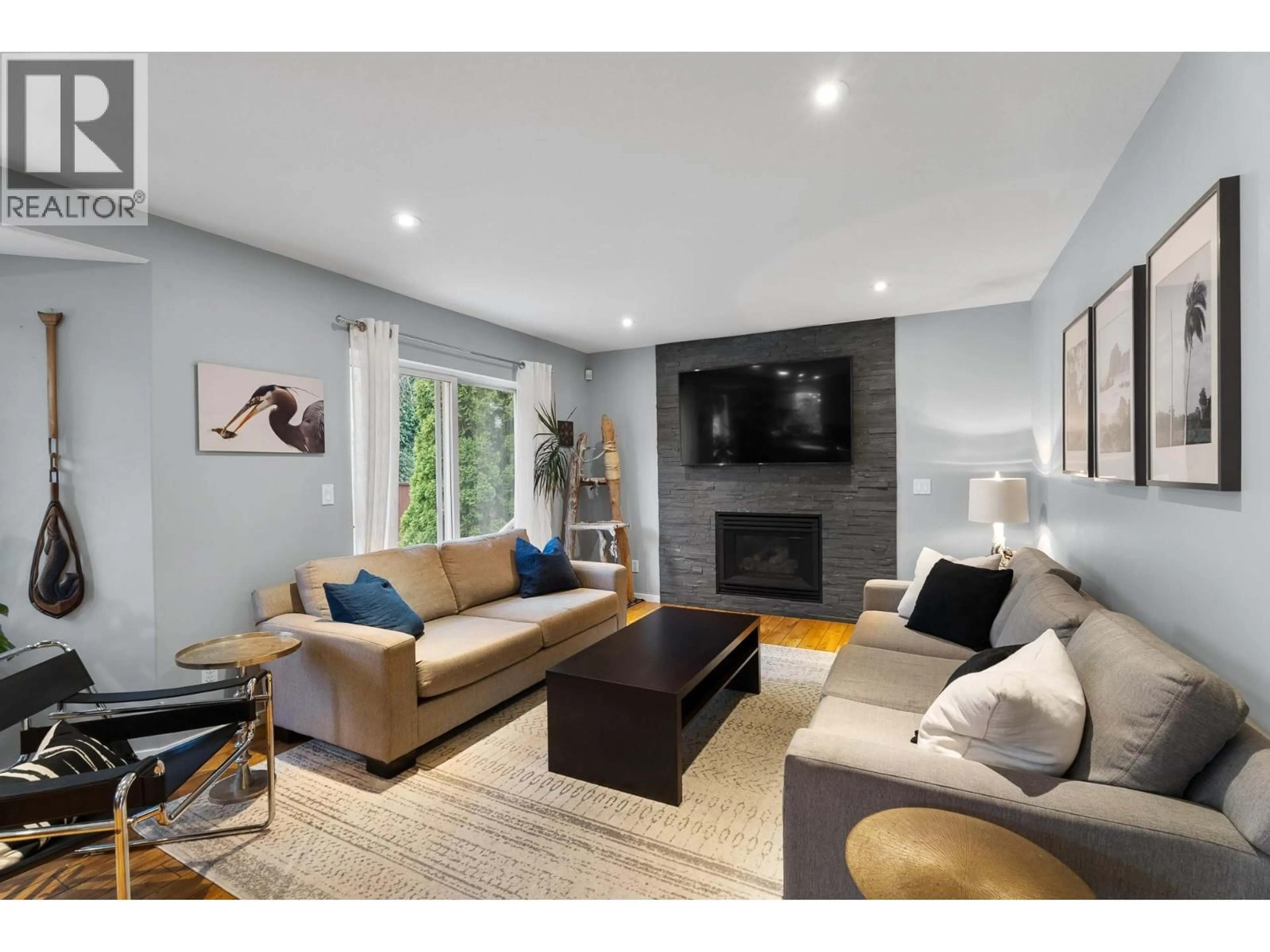 Living room with furniture, wood/laminate floor for 461 SEDONA DRIVE, Kamloops British Columbia V2E2R1