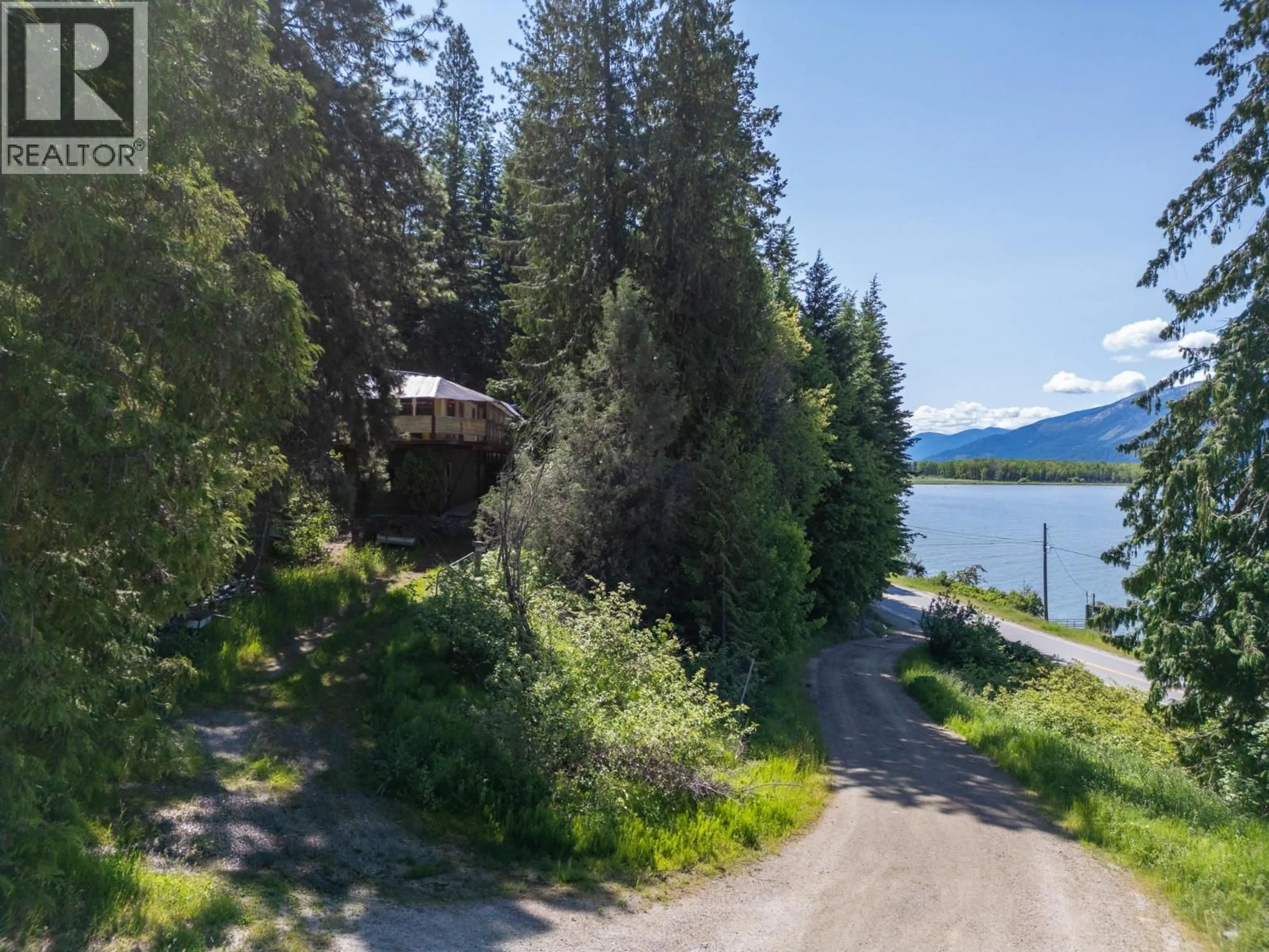 A pic from outside/outdoor area/front of a property/back of a property/a pic from drone, water/lake/river/ocean view for 9308 MAIN STREET, Kuskanook British Columbia V0B2C0