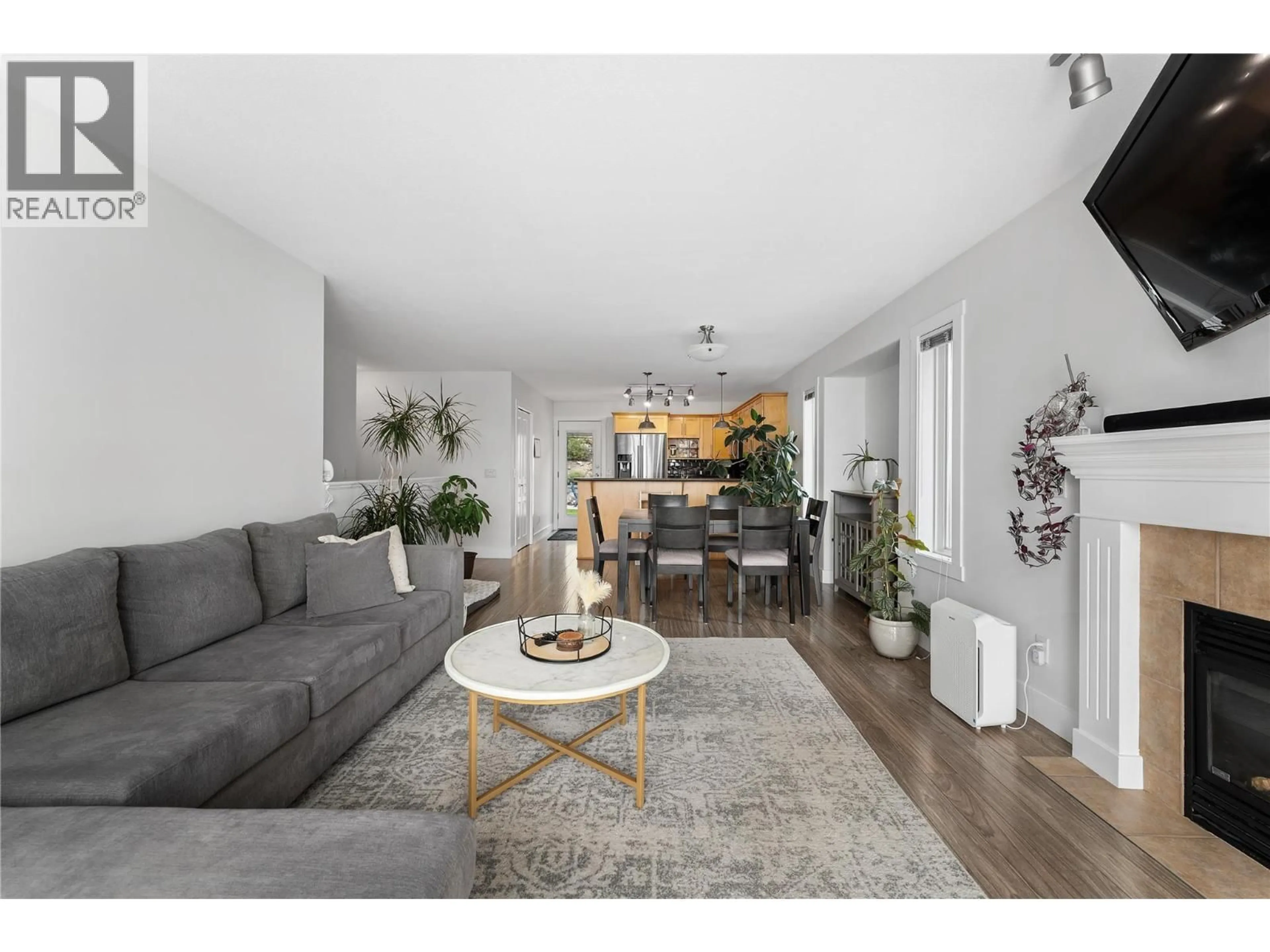 Living room with furniture, wood/laminate floor for 2334 SHANNON HEIGHTS PLACE, West Kelowna British Columbia V4T2V2