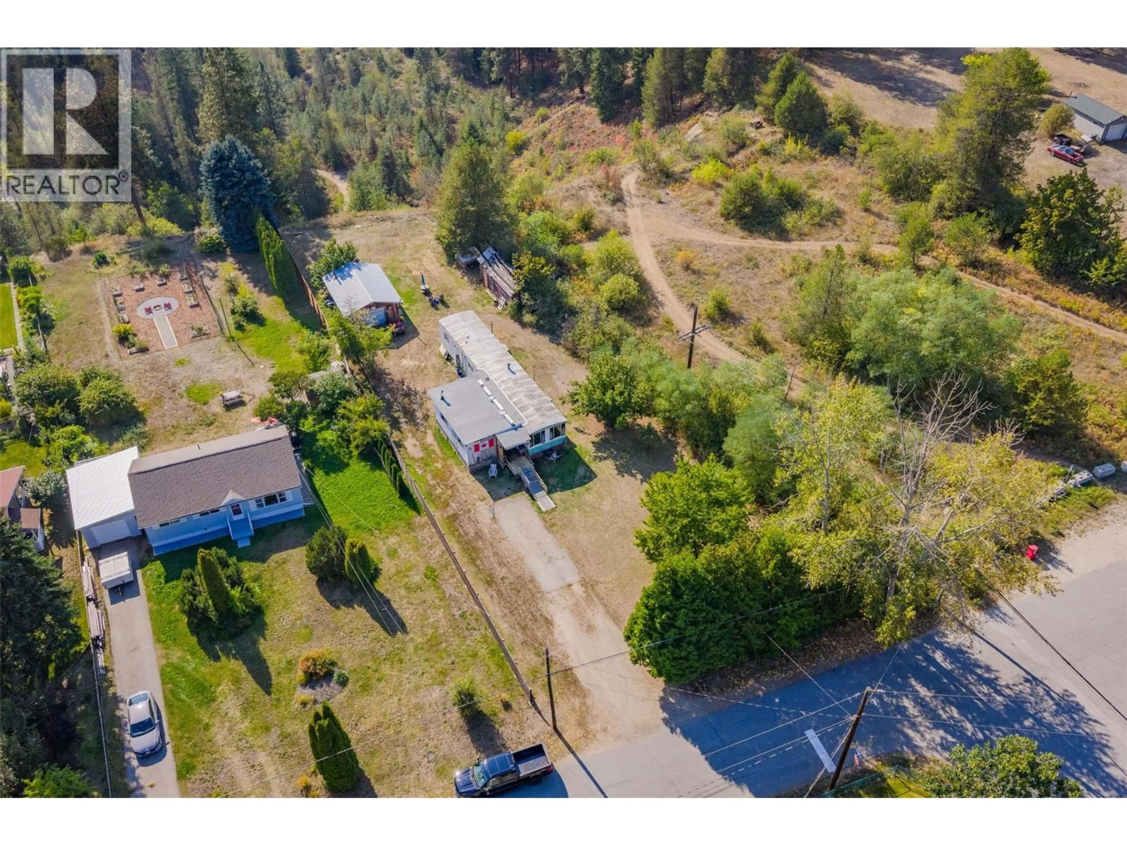 A pic from outside/outdoor area/front of a property/back of a property/a pic from drone, street for 126 100TH STREET, Castlegar British Columbia V1N3C5