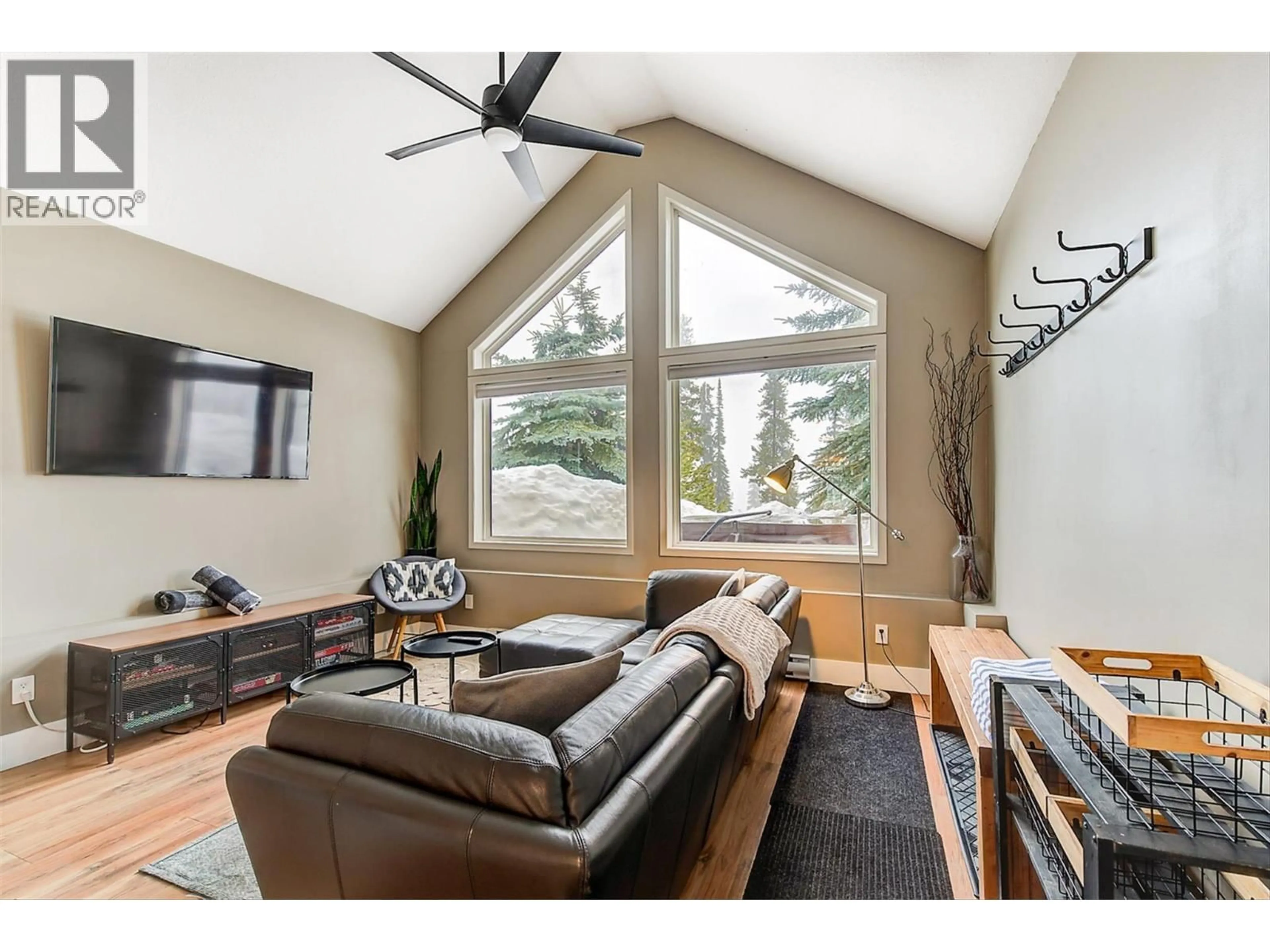 Living room with furniture, wood/laminate floor for 116D - 5977 SNOW PINES CRESCENT, Big White British Columbia V1P1P3