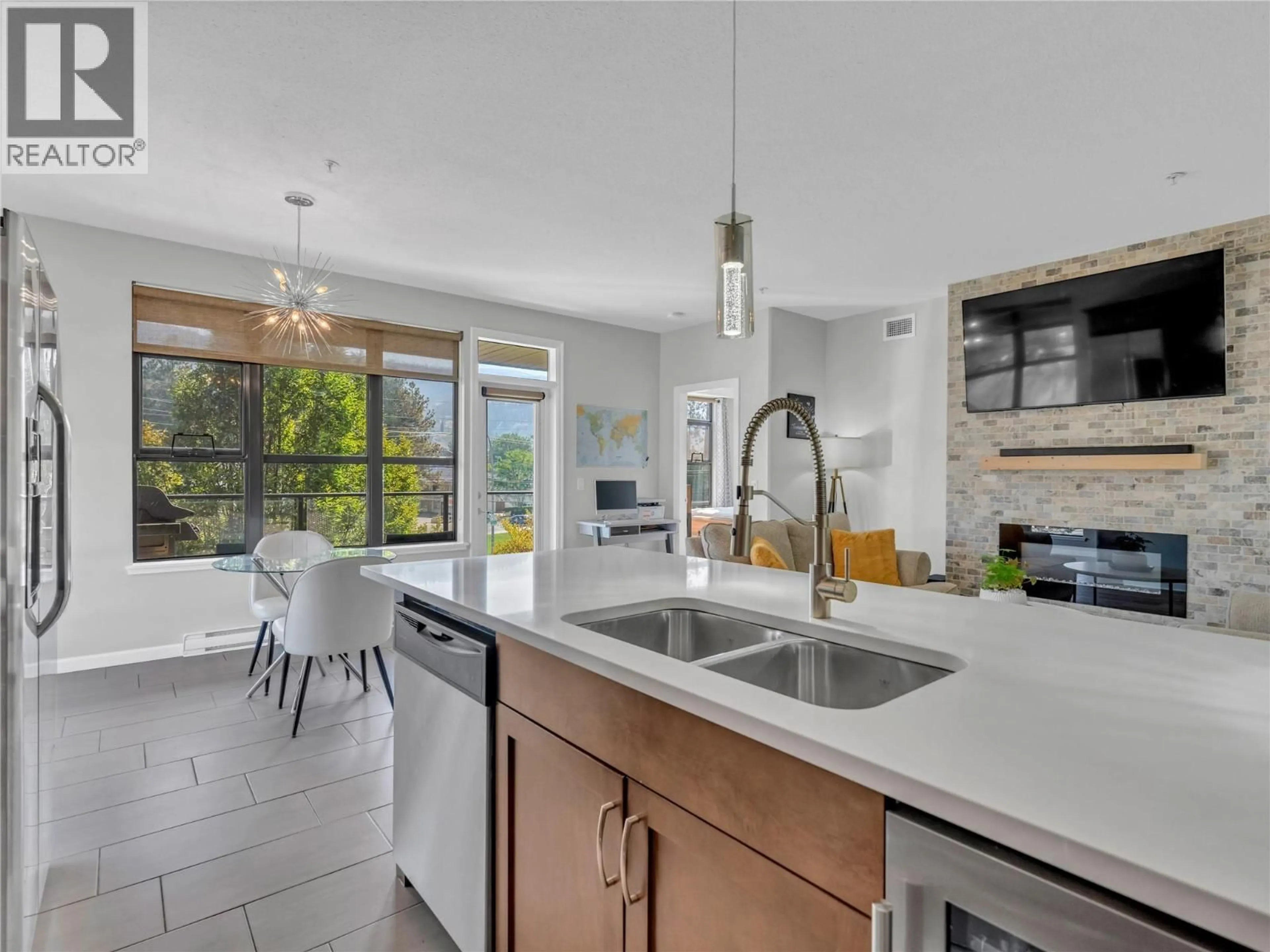 Open concept kitchen, ceramic/tile floor for 303 - 3589 SKAHA LAKE ROAD, Penticton British Columbia V2A7K2