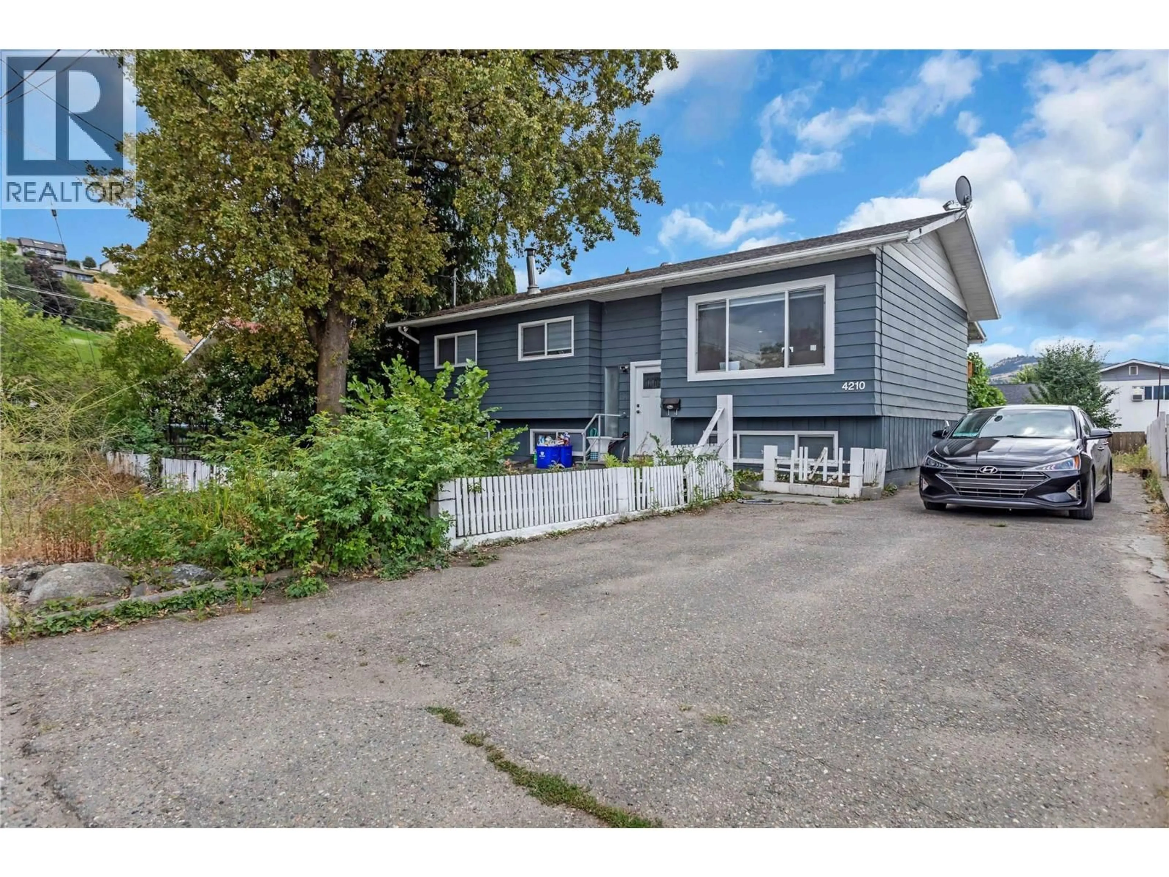 Home with vinyl exterior material, street for 4210 17 AVENUE, Vernon British Columbia V1T7K8