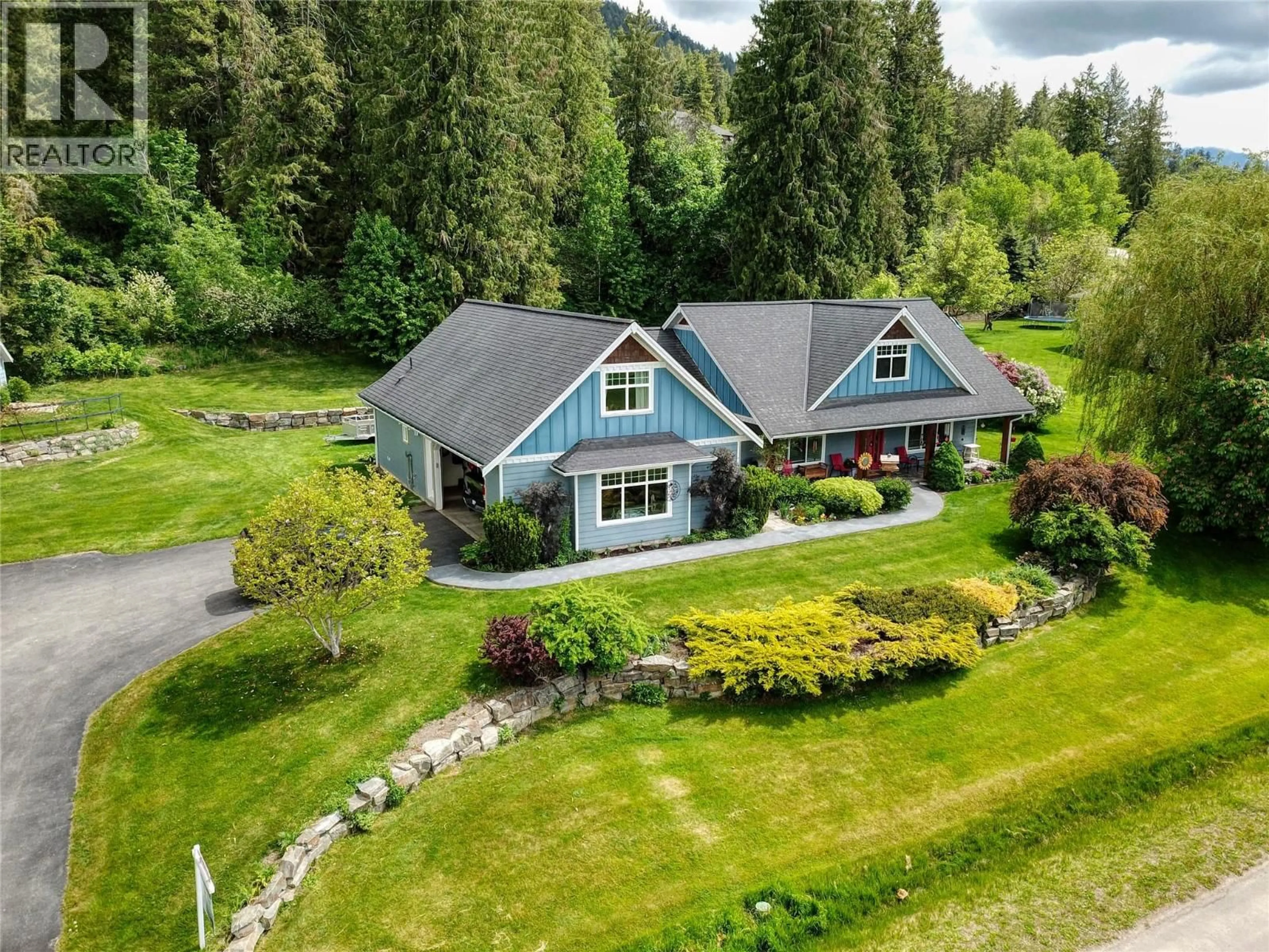 A pic from outside/outdoor area/front of a property/back of a property/a pic from drone, mountain view for 1324 8TH AVENUE NORTH, Creston British Columbia V0B1G6