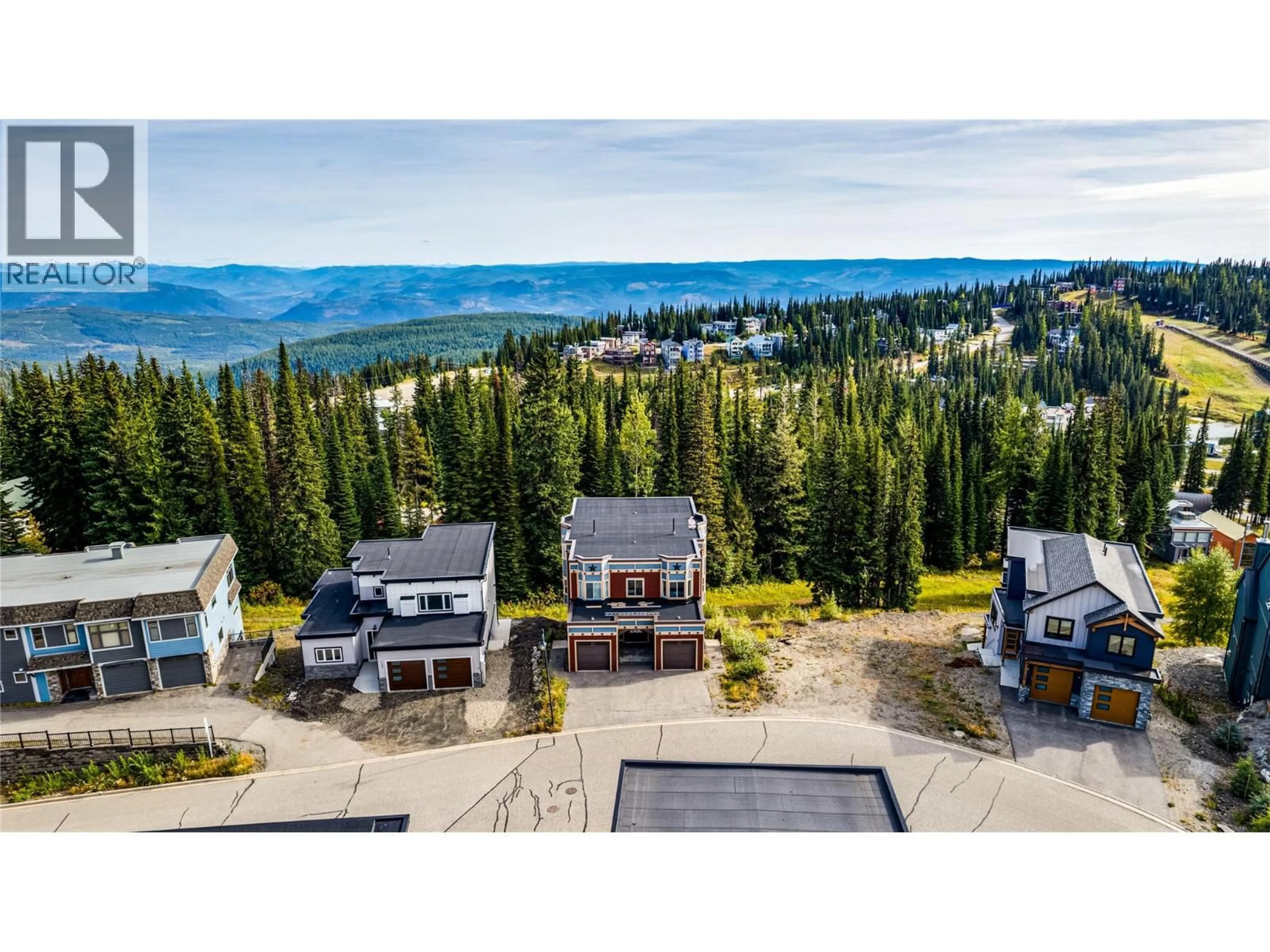 A pic from outside/outdoor area/front of a property/back of a property/a pic from drone, mountain view for 130 ARNICA LANE, Silver Star British Columbia V1B0S2