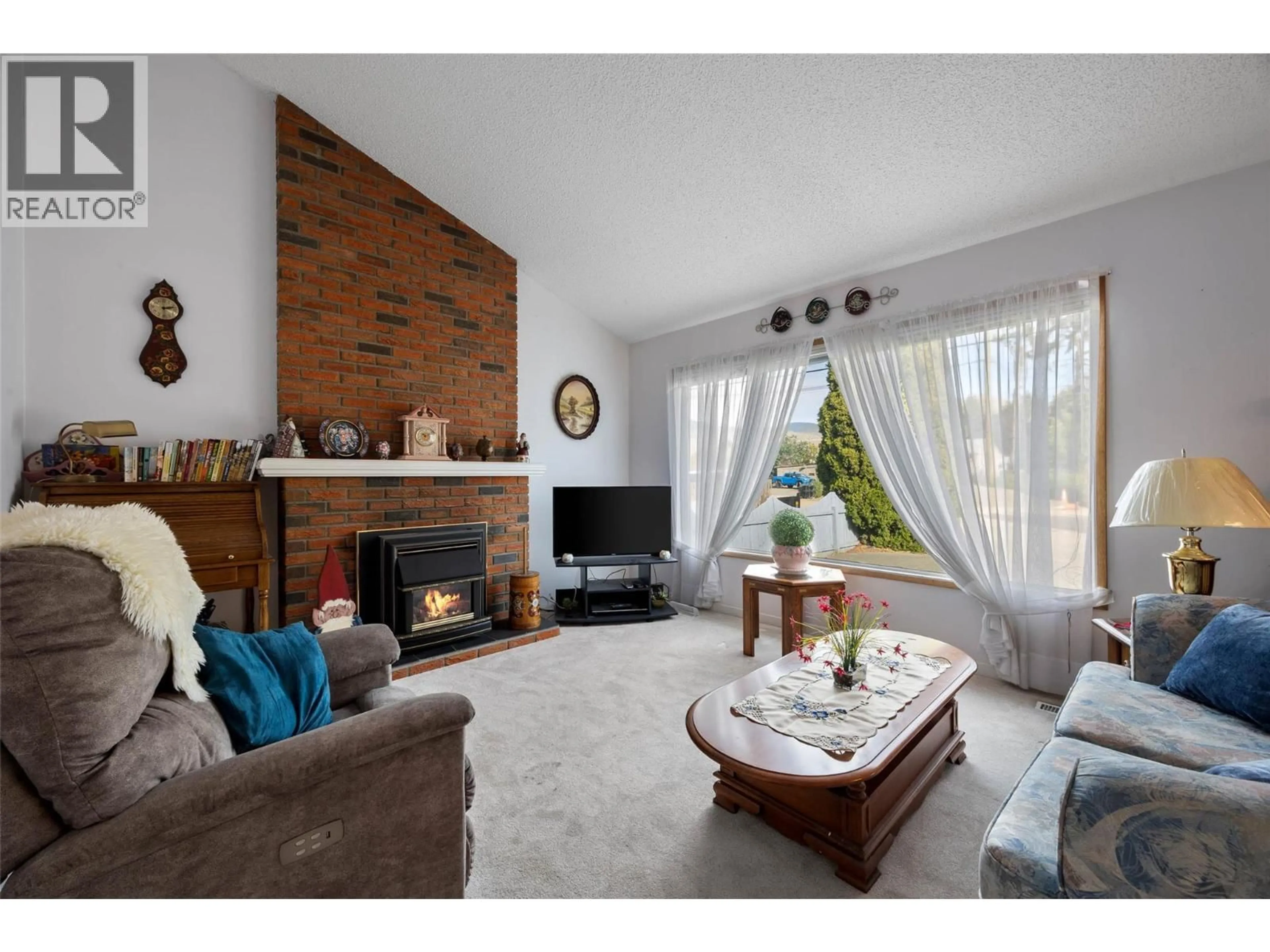 Living room with furniture, wood/laminate floor for 2341 TRANQUILLE ROAD, Kamloops British Columbia V2B3N6