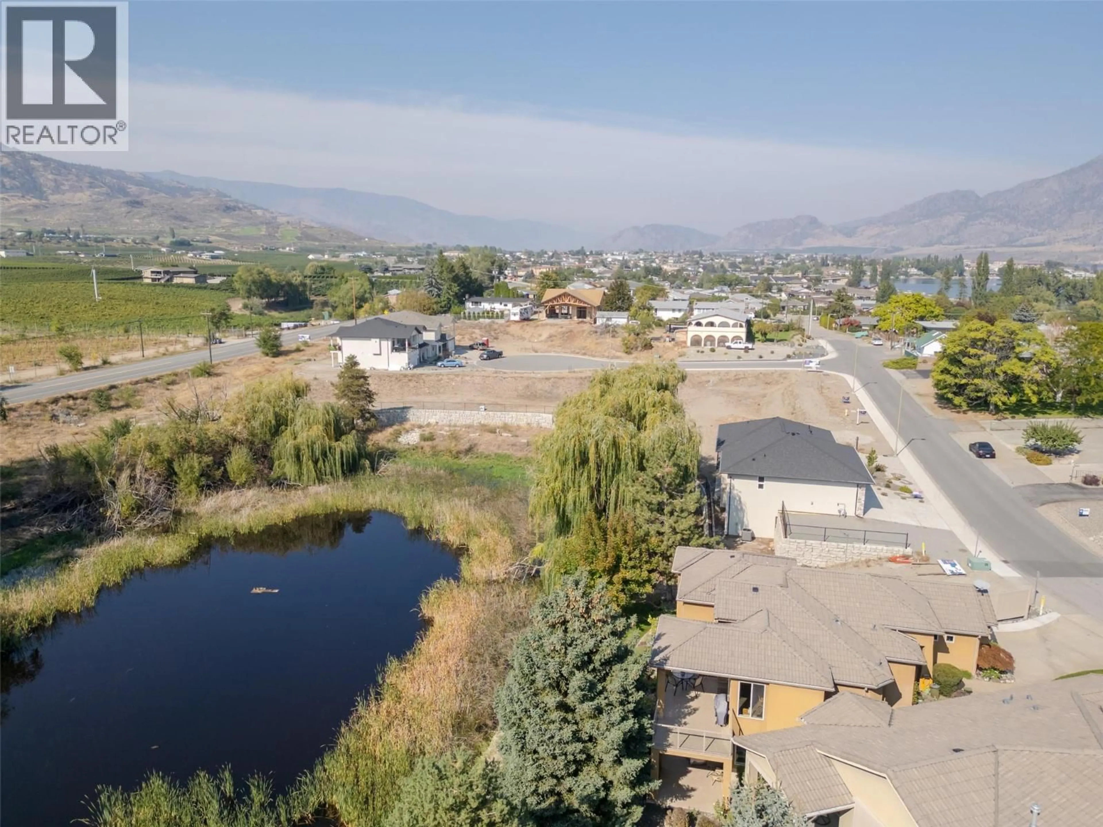 A pic from outside/outdoor area/front of a property/back of a property/a pic from drone, mountain view for 3604 LOBELIA DRIVE, Osoyoos British Columbia V0H1V1