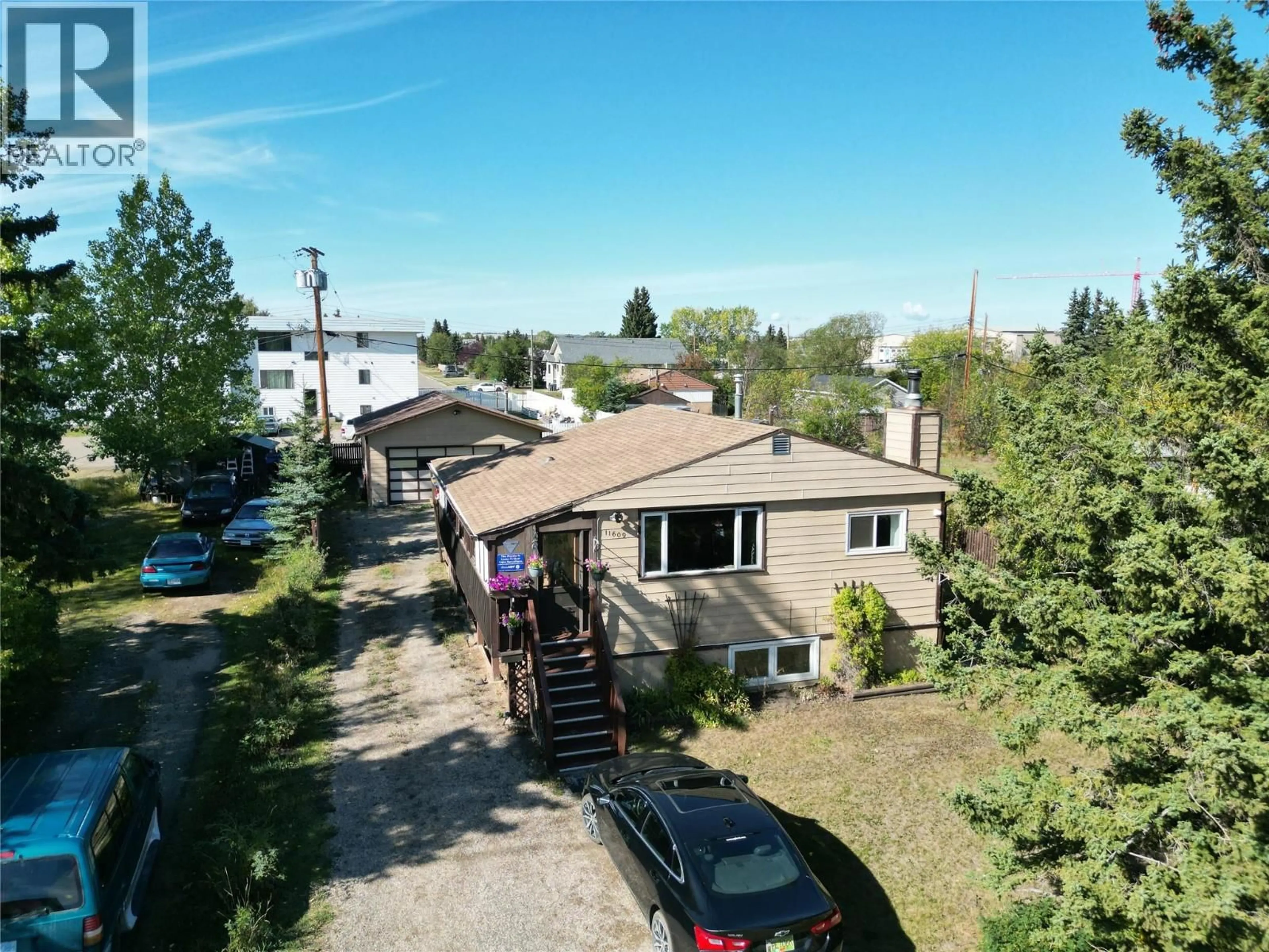 A pic from outside/outdoor area/front of a property/back of a property/a pic from drone, street for 11609 9 STREET, Dawson Creek British Columbia V1G3S8