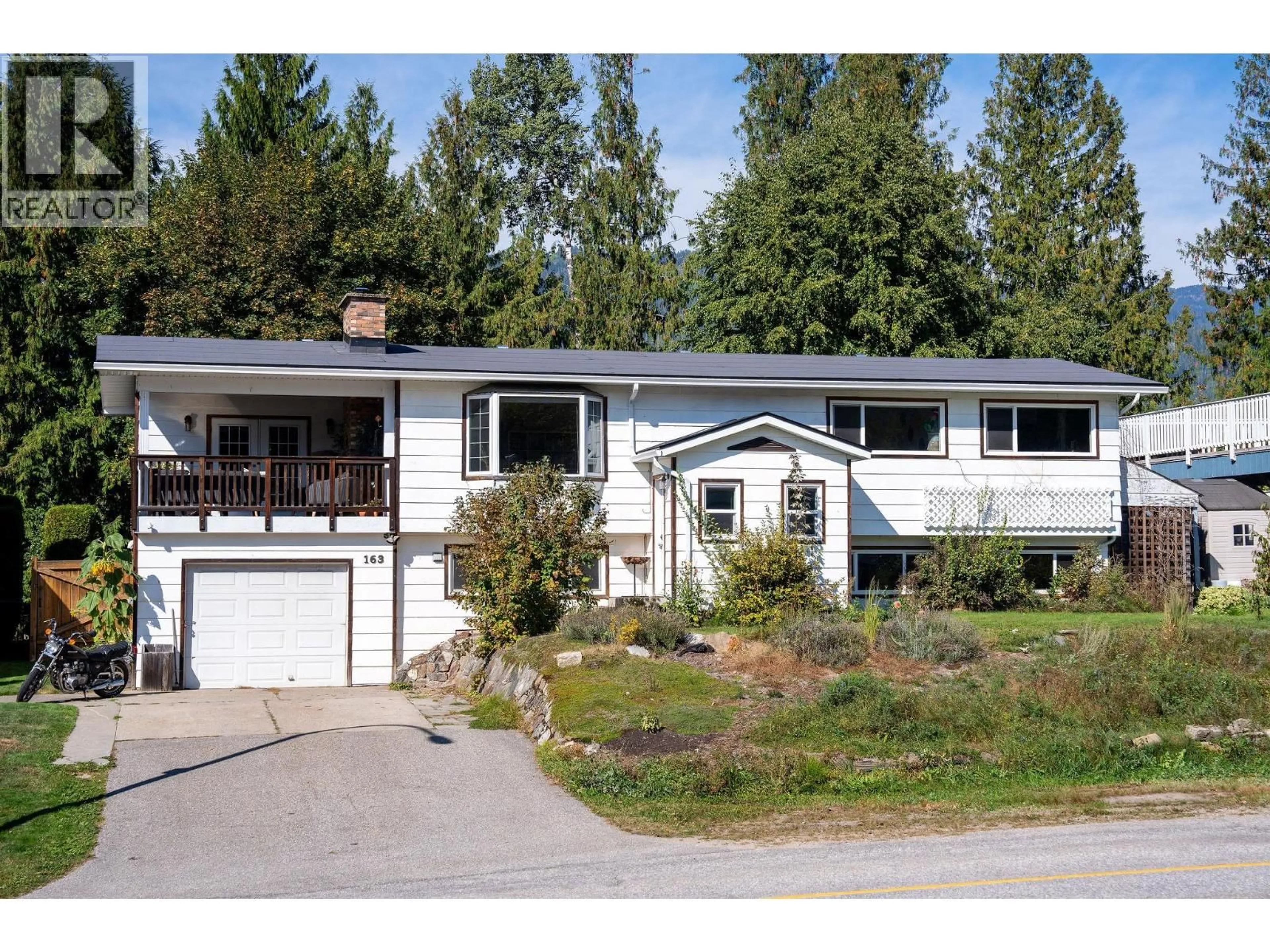 Home with vinyl exterior material, street for 163 PEARKES DRIVE, Revelstoke British Columbia V0E2S0