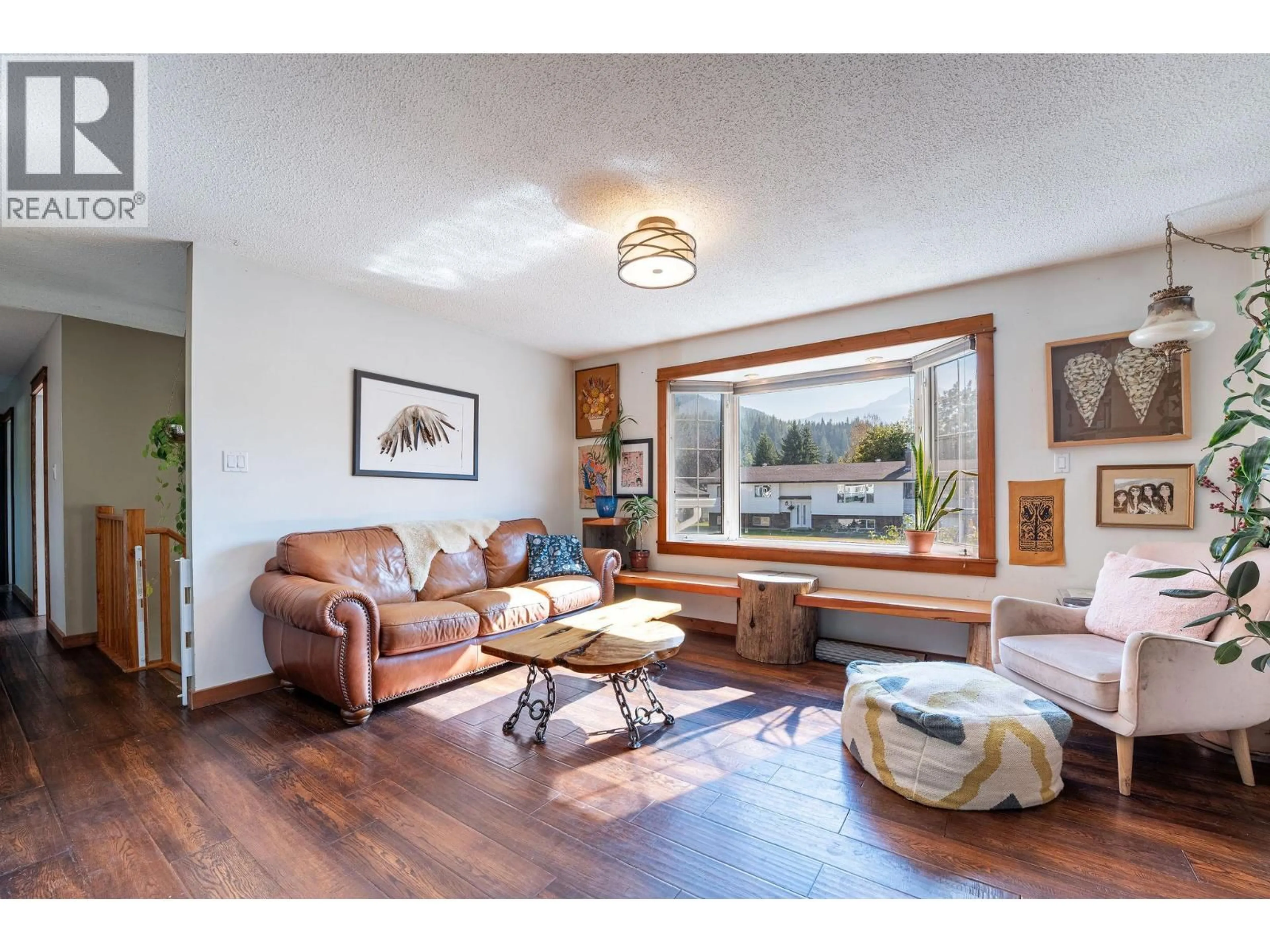 Living room with furniture, wood/laminate floor for 163 PEARKES DRIVE, Revelstoke British Columbia V0E2S0