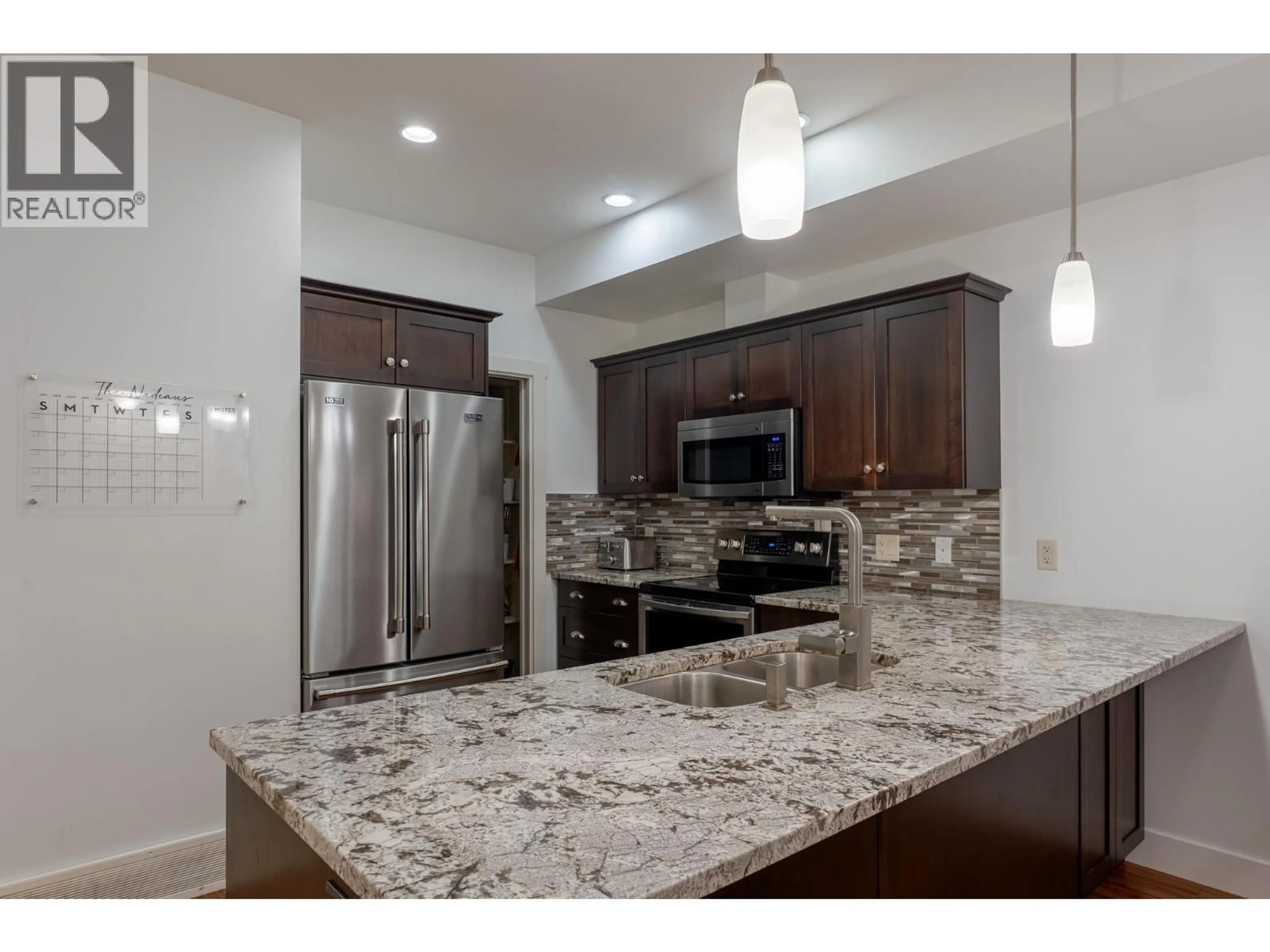 Open concept kitchen, ceramic/tile floor for 2 - 600 BOYNTON PLACE, Kelowna British Columbia V1V3B8