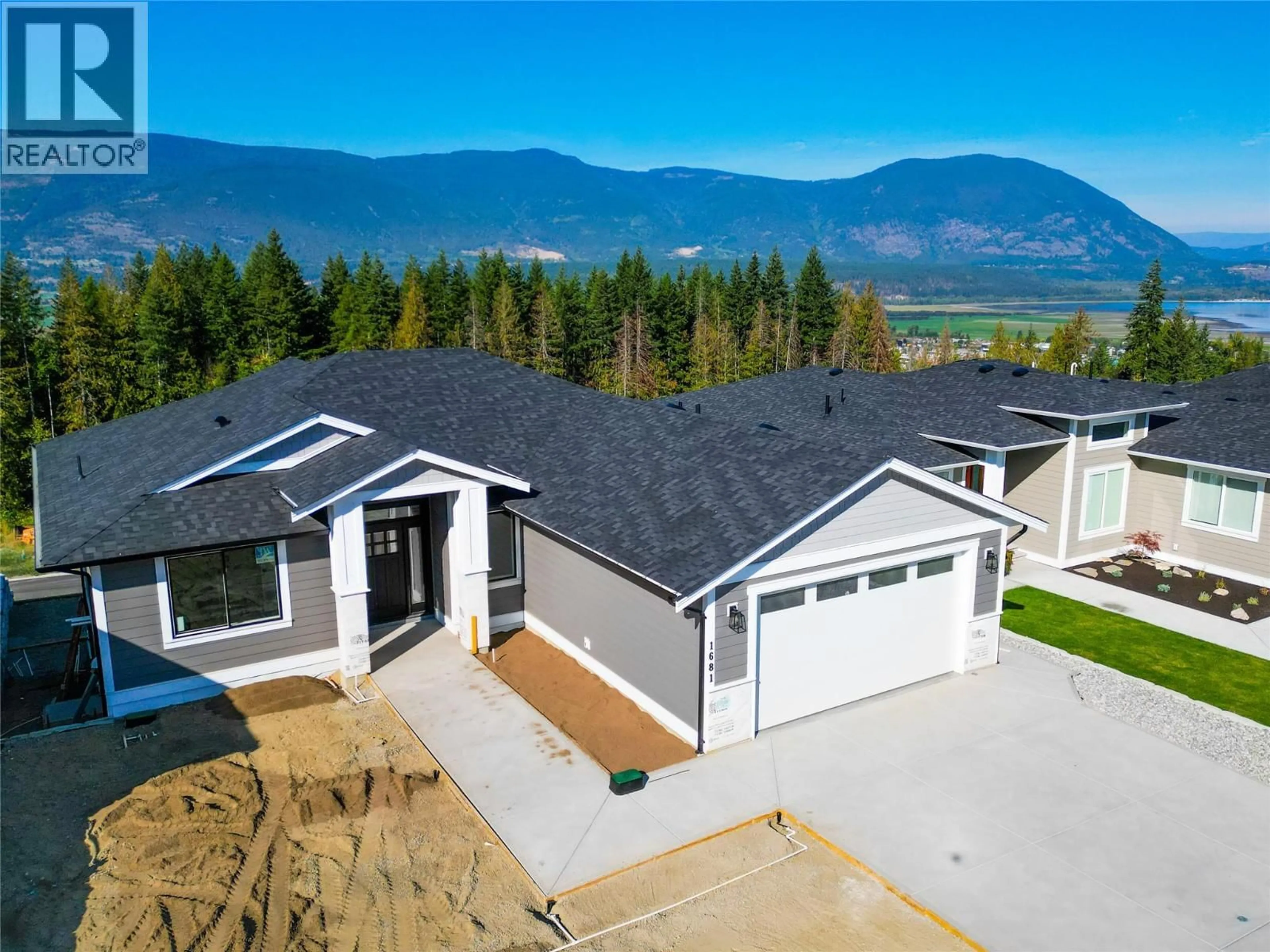 A pic from outside/outdoor area/front of a property/back of a property/a pic from drone, mountain view for 1681 9 STREET SOUTHEAST, Salmon Arm British Columbia V1E0G9