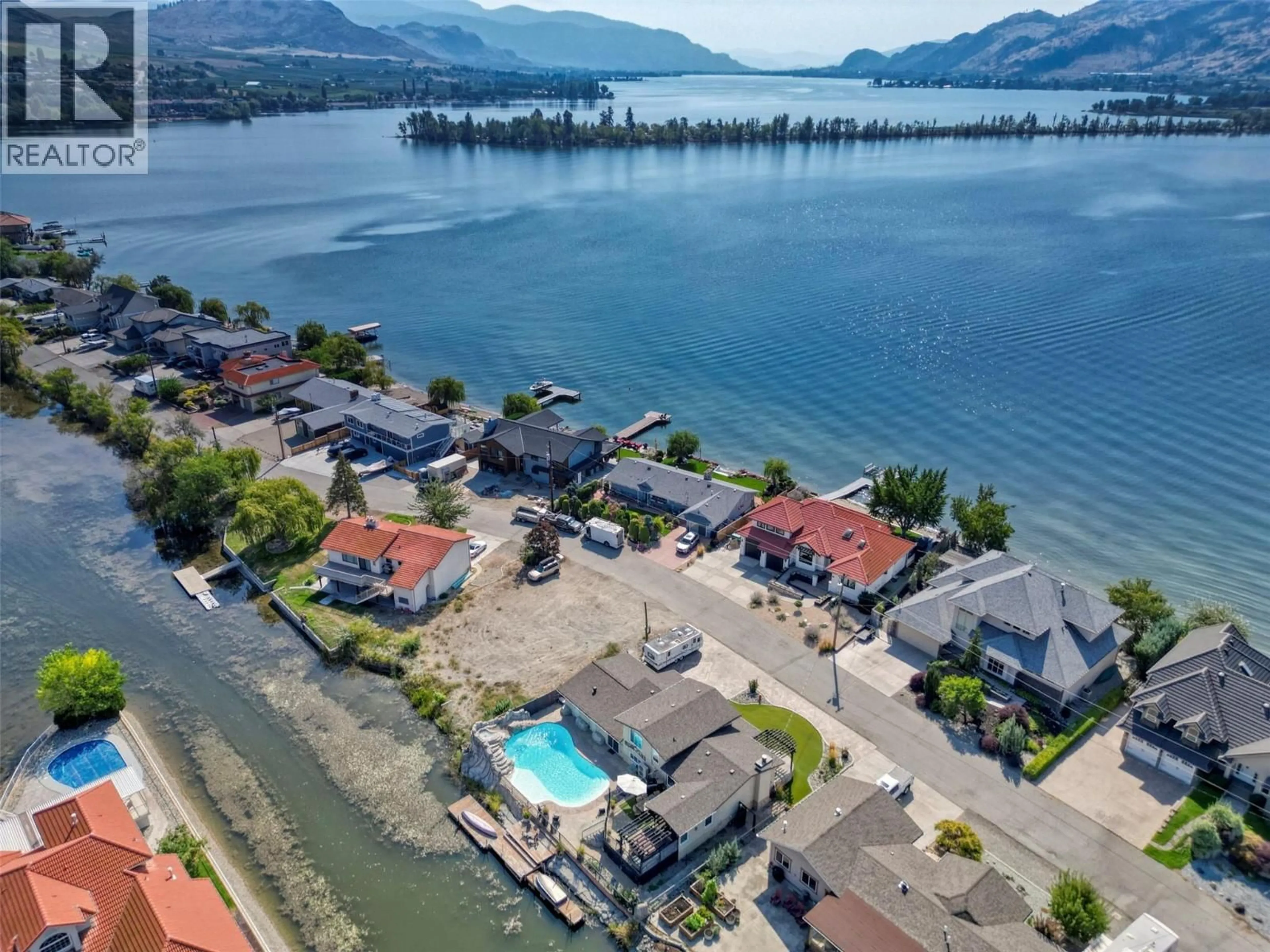 A pic from outside/outdoor area/front of a property/back of a property/a pic from drone, water/lake/river/ocean view for 52 HARBOUR KEY DRIVE, Osoyoos British Columbia V0H1V3