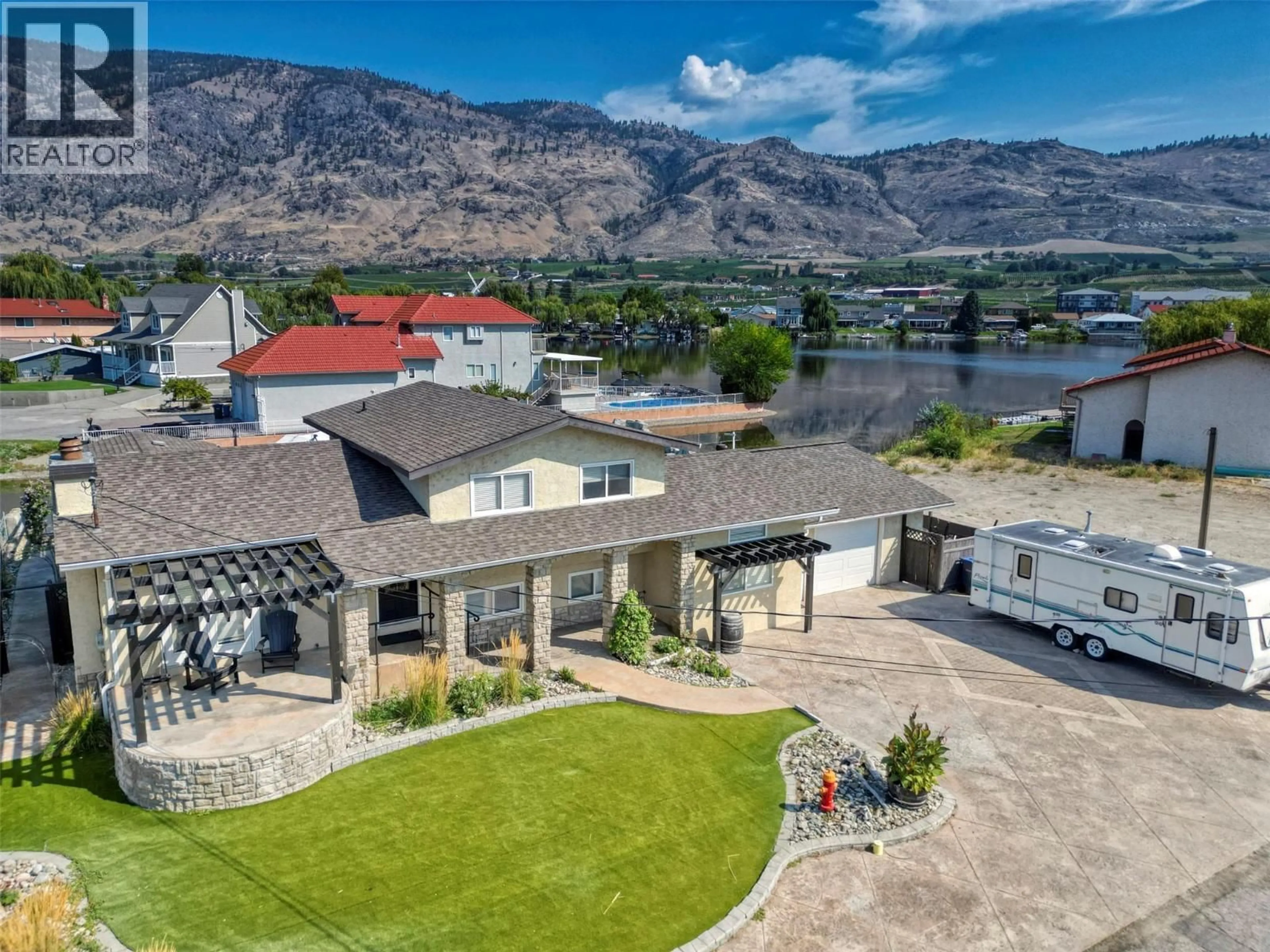 A pic from outside/outdoor area/front of a property/back of a property/a pic from drone, water/lake/river/ocean view for 52 HARBOUR KEY DRIVE, Osoyoos British Columbia V0H1V3