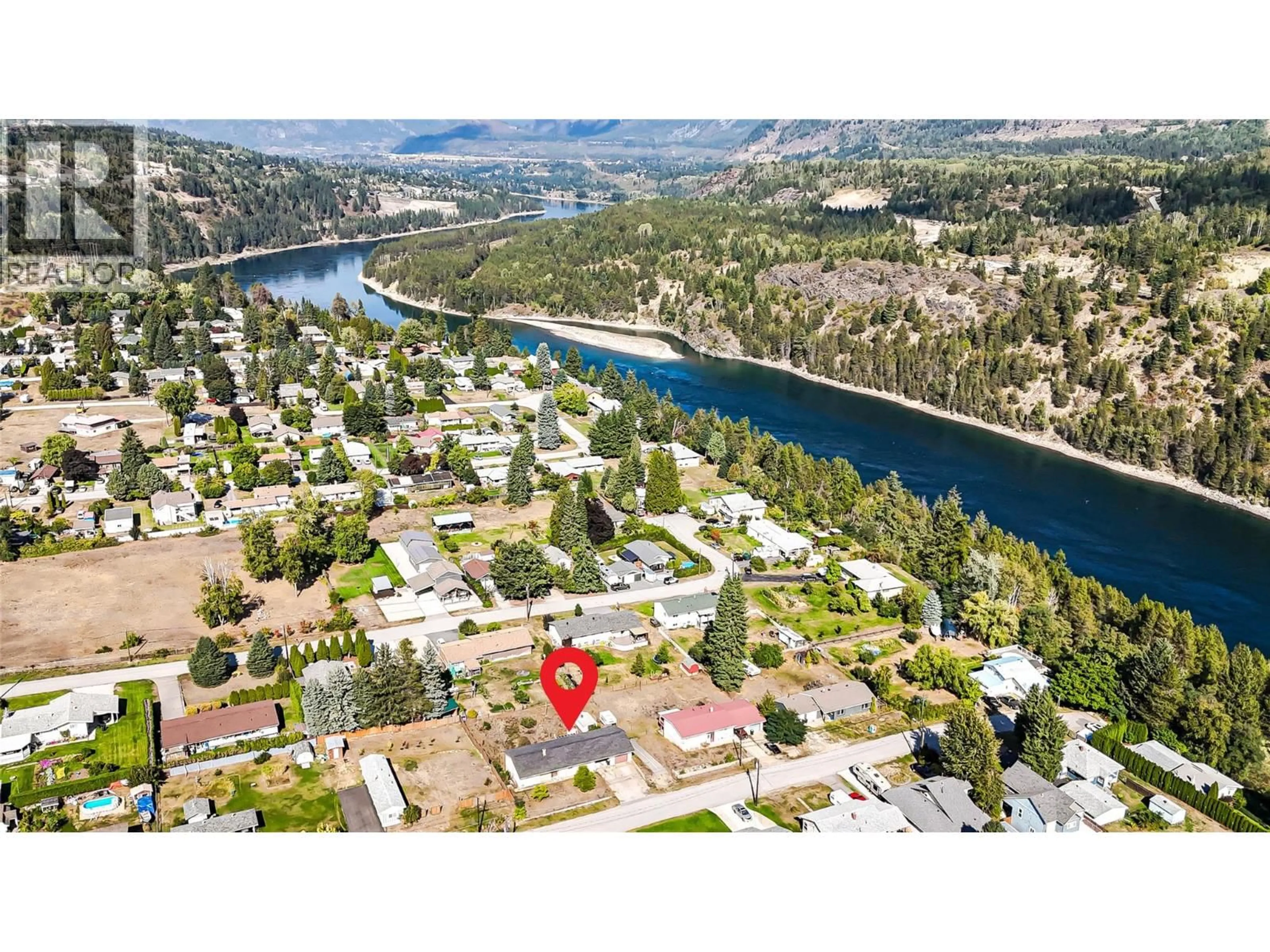A pic from outside/outdoor area/front of a property/back of a property/a pic from drone, water/lake/river/ocean view for 115 101ST STREET, Castlegar British Columbia V1N3E3