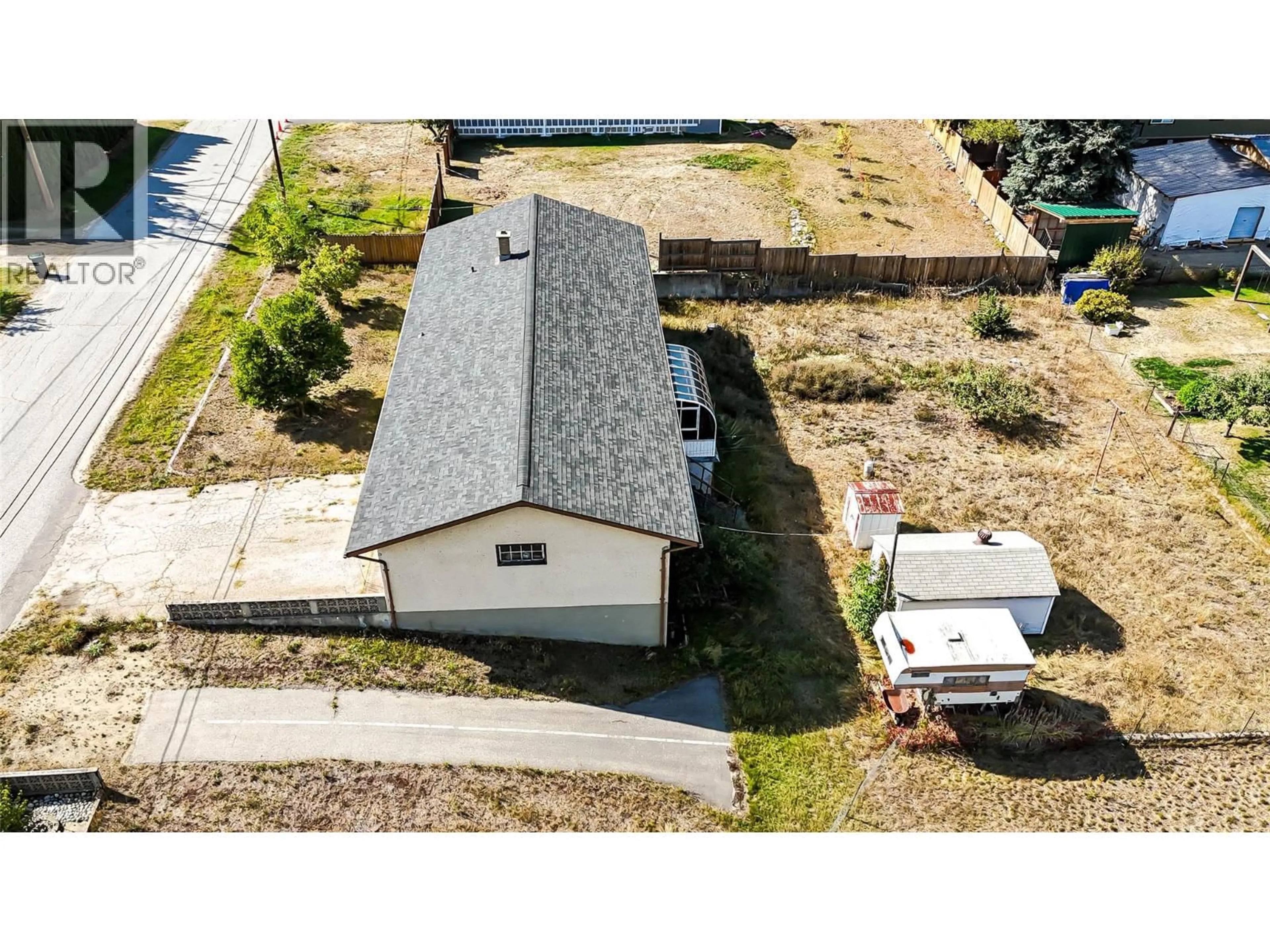 A pic from outside/outdoor area/front of a property/back of a property/a pic from drone, building for 115 101ST STREET, Castlegar British Columbia V1N3E3