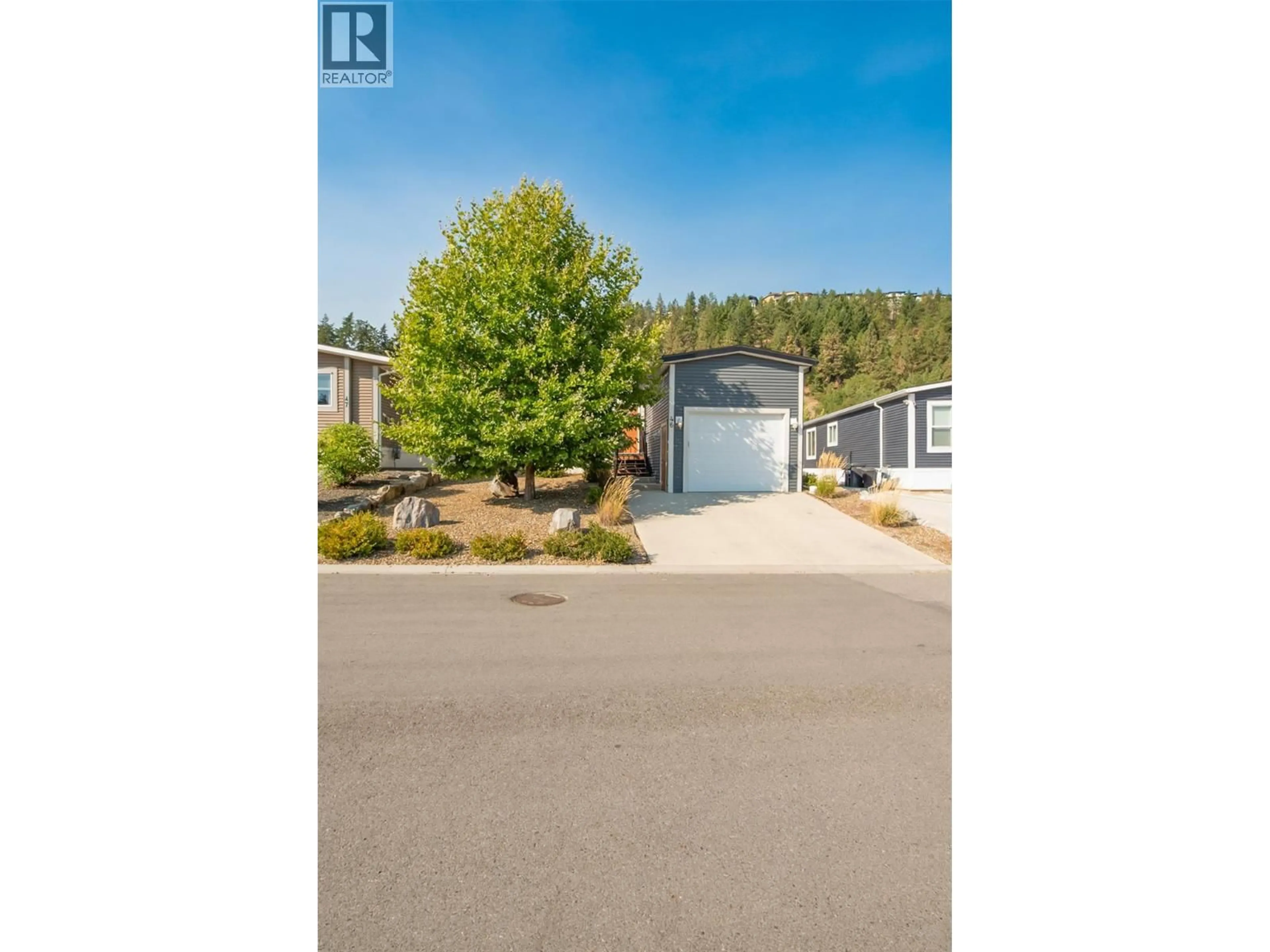 A pic from outside/outdoor area/front of a property/back of a property/a pic from drone, street for 46 - 1835 NANCEE WAY COURT, Kelowna British Columbia V1Z4C1