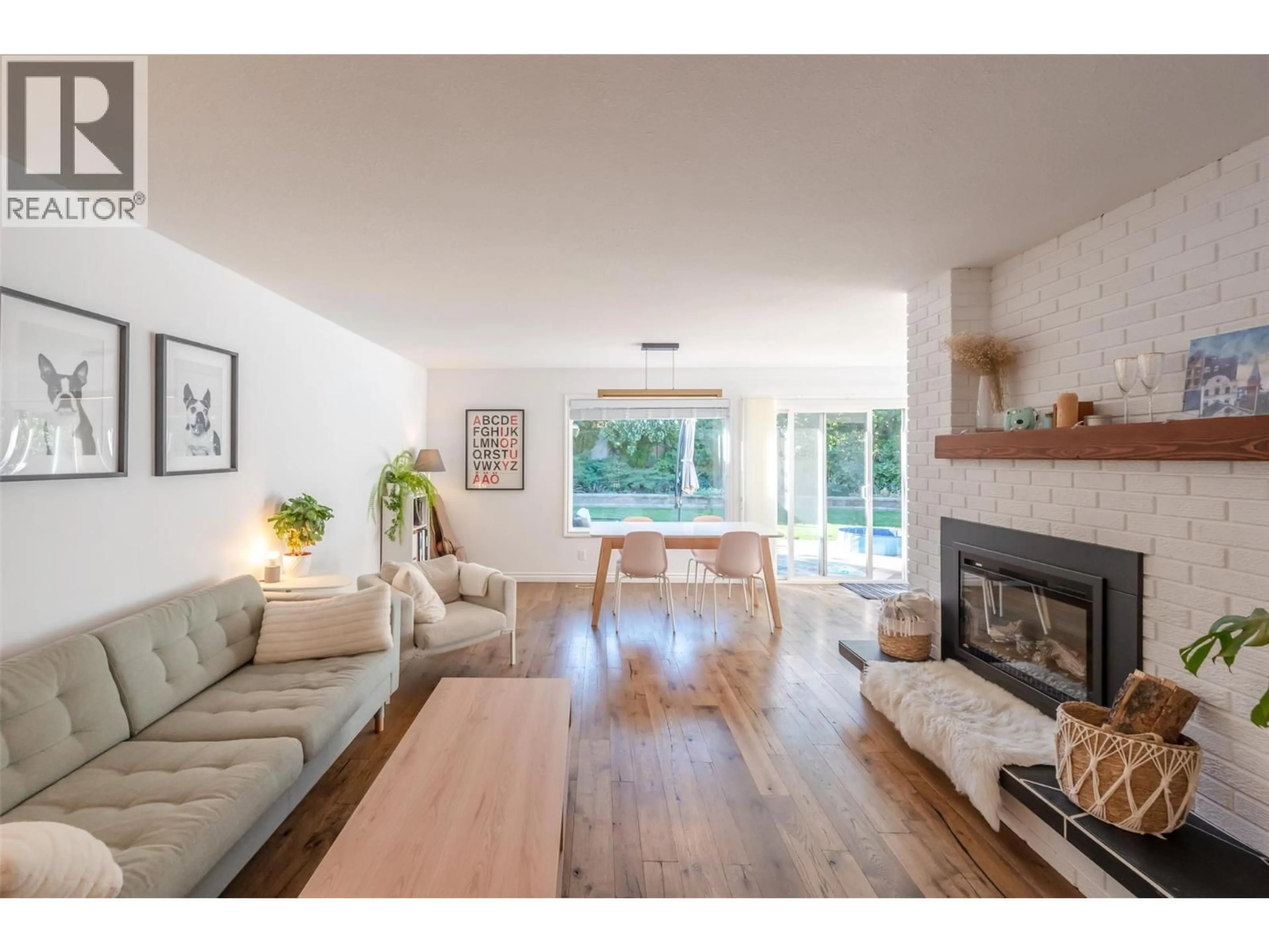Living room with furniture, wood/laminate floor for 110 DAFOE PLACE, Penticton British Columbia V2A7E6