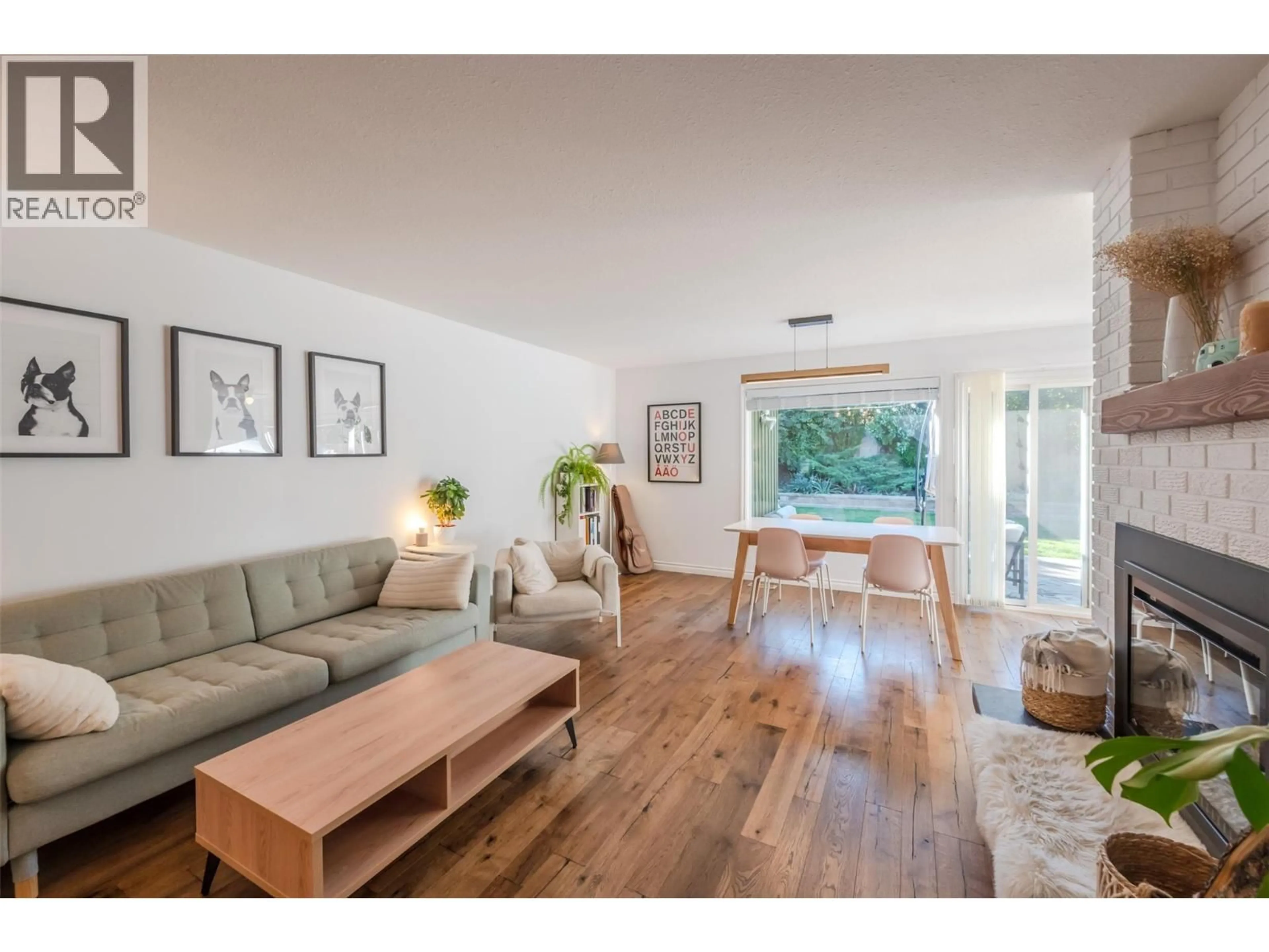 Living room with furniture, wood/laminate floor for 110 DAFOE PLACE, Penticton British Columbia V2A7E6