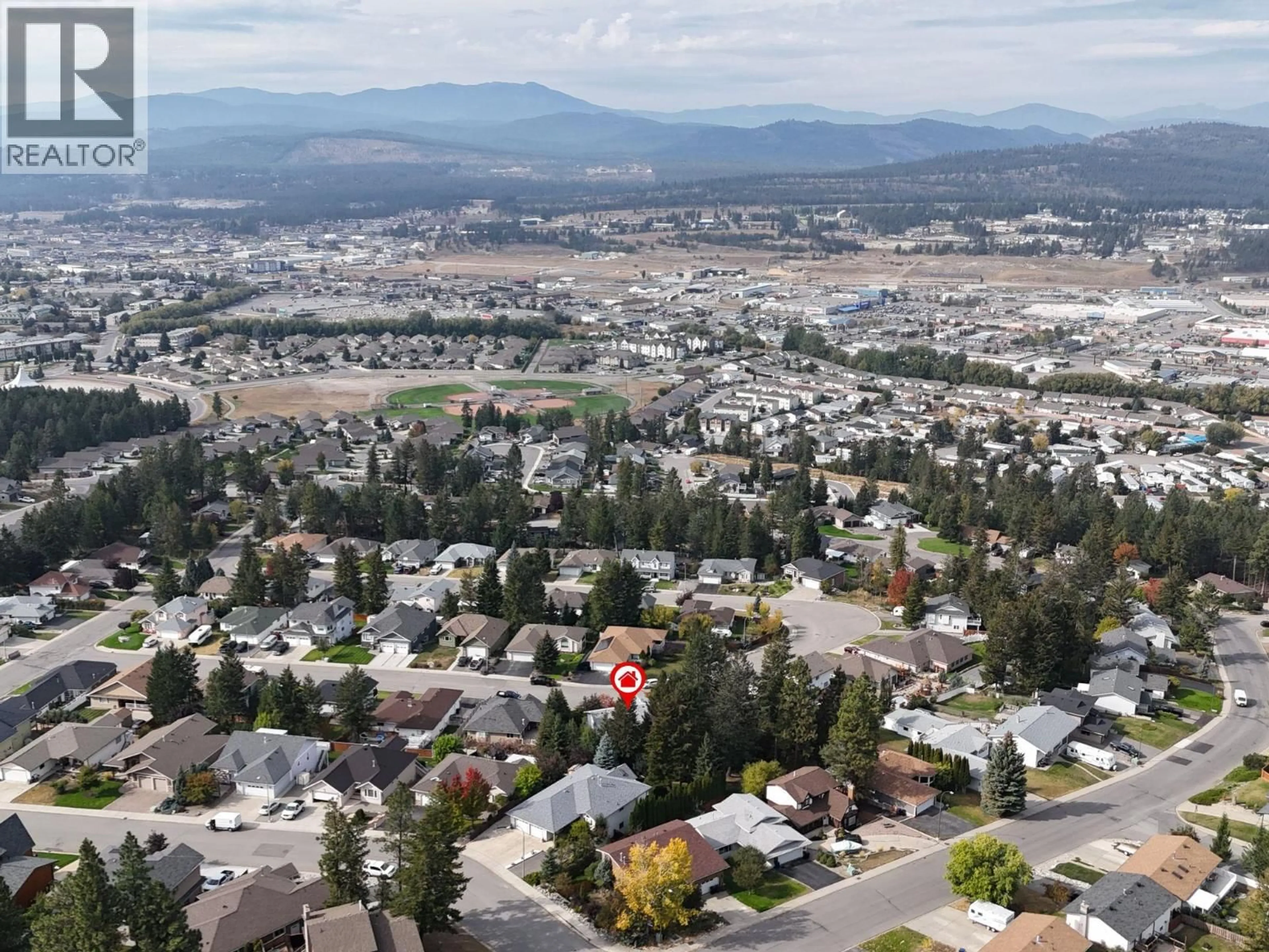 A pic from outside/outdoor area/front of a property/back of a property/a pic from drone, mountain view for 1646 MT PYRAMID CRESCENT, Cranbrook British Columbia V1C6N6