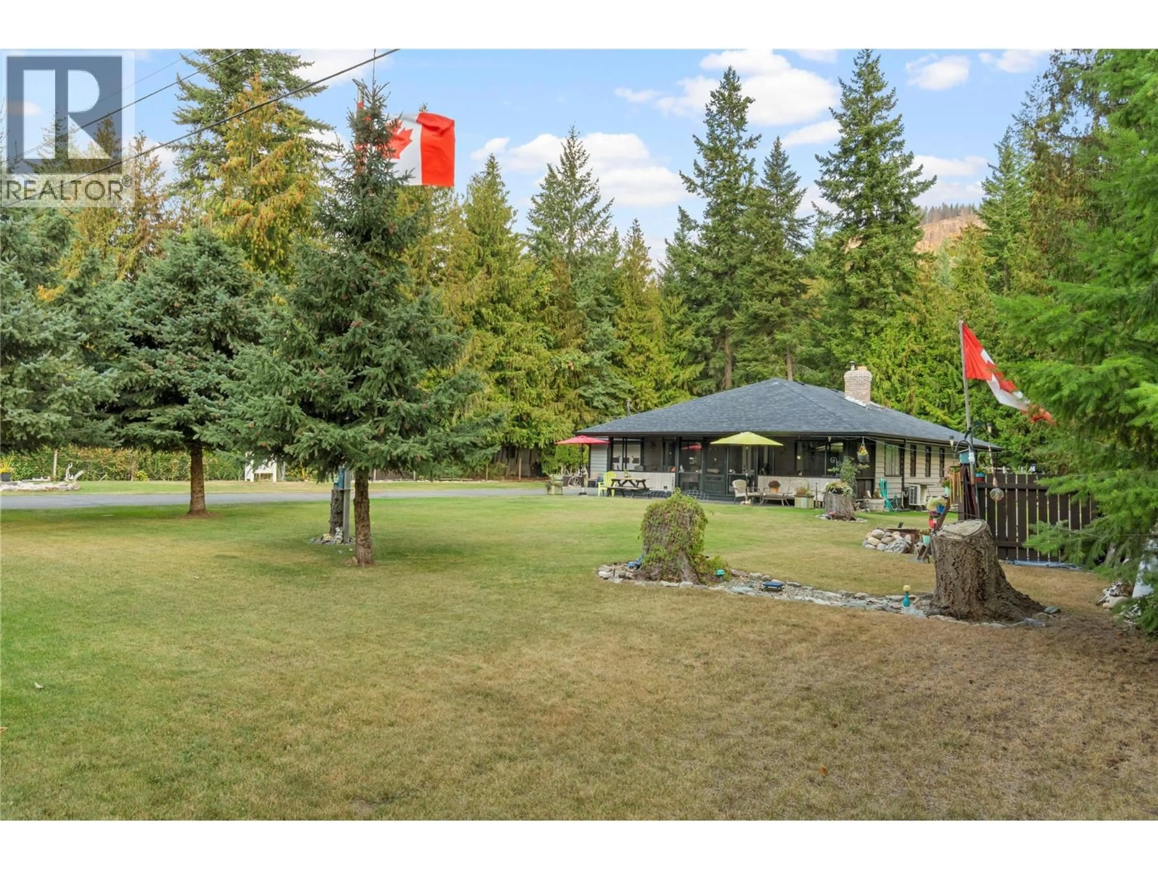 A pic from outside/outdoor area/front of a property/back of a property/a pic from drone, forest/trees view for 4061 SANTA ROAD, Scotch Creek British Columbia V0E1M6