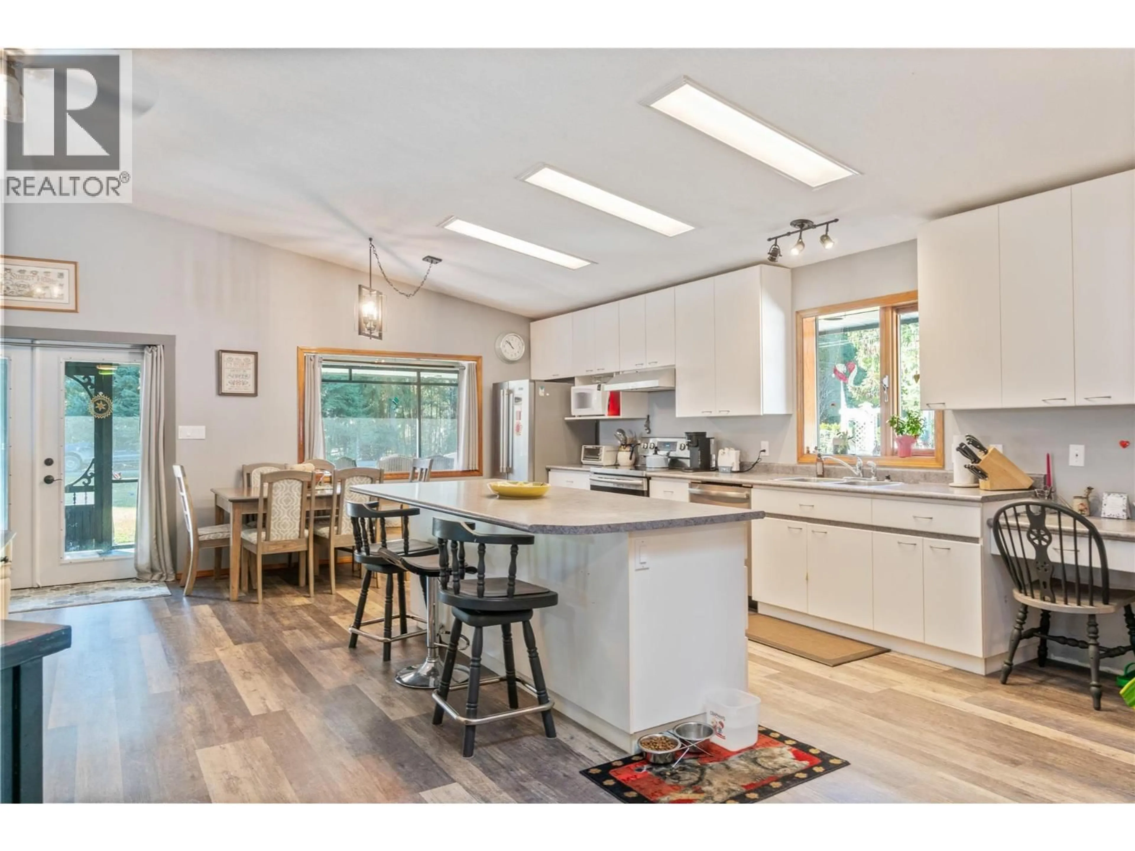 Open concept kitchen, wood/laminate floor for 4061 SANTA ROAD, Scotch Creek British Columbia V0E1M6