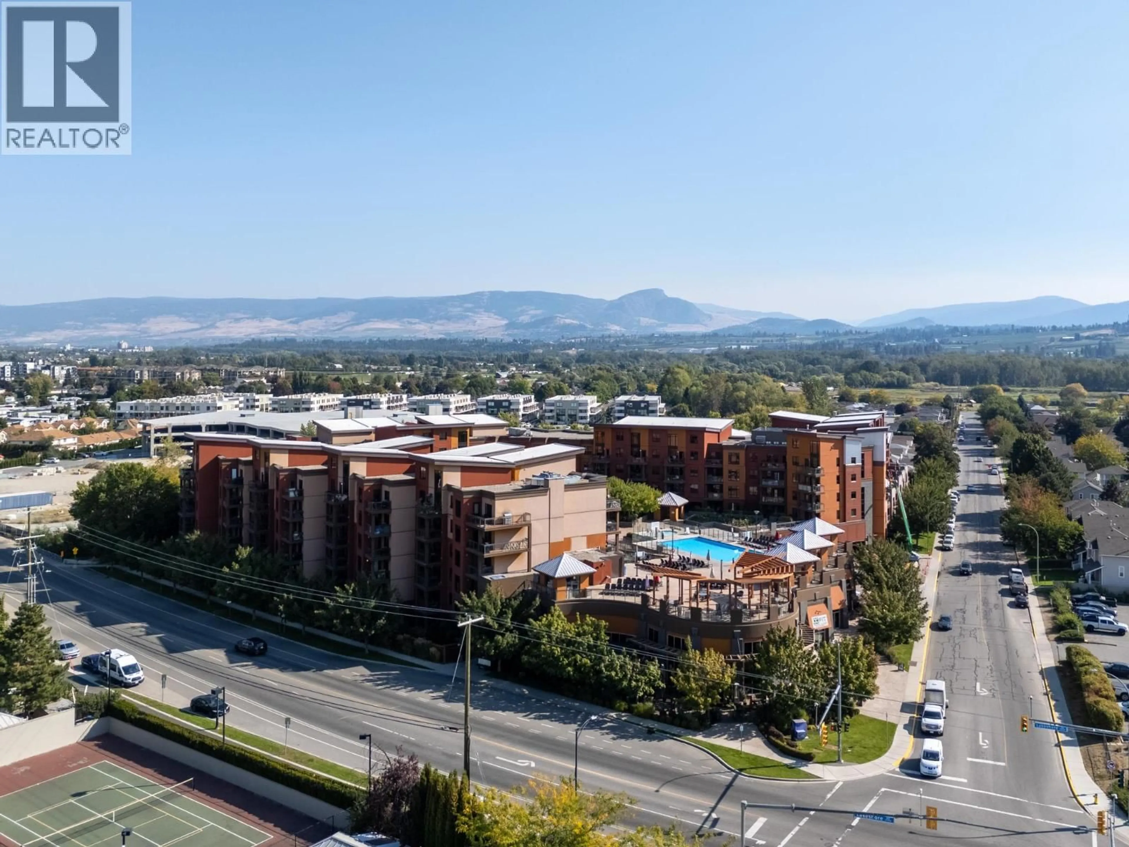 A pic from outside/outdoor area/front of a property/back of a property/a pic from drone, mountain view for 618 - 654 COOK ROAD, Kelowna British Columbia V1W3G7