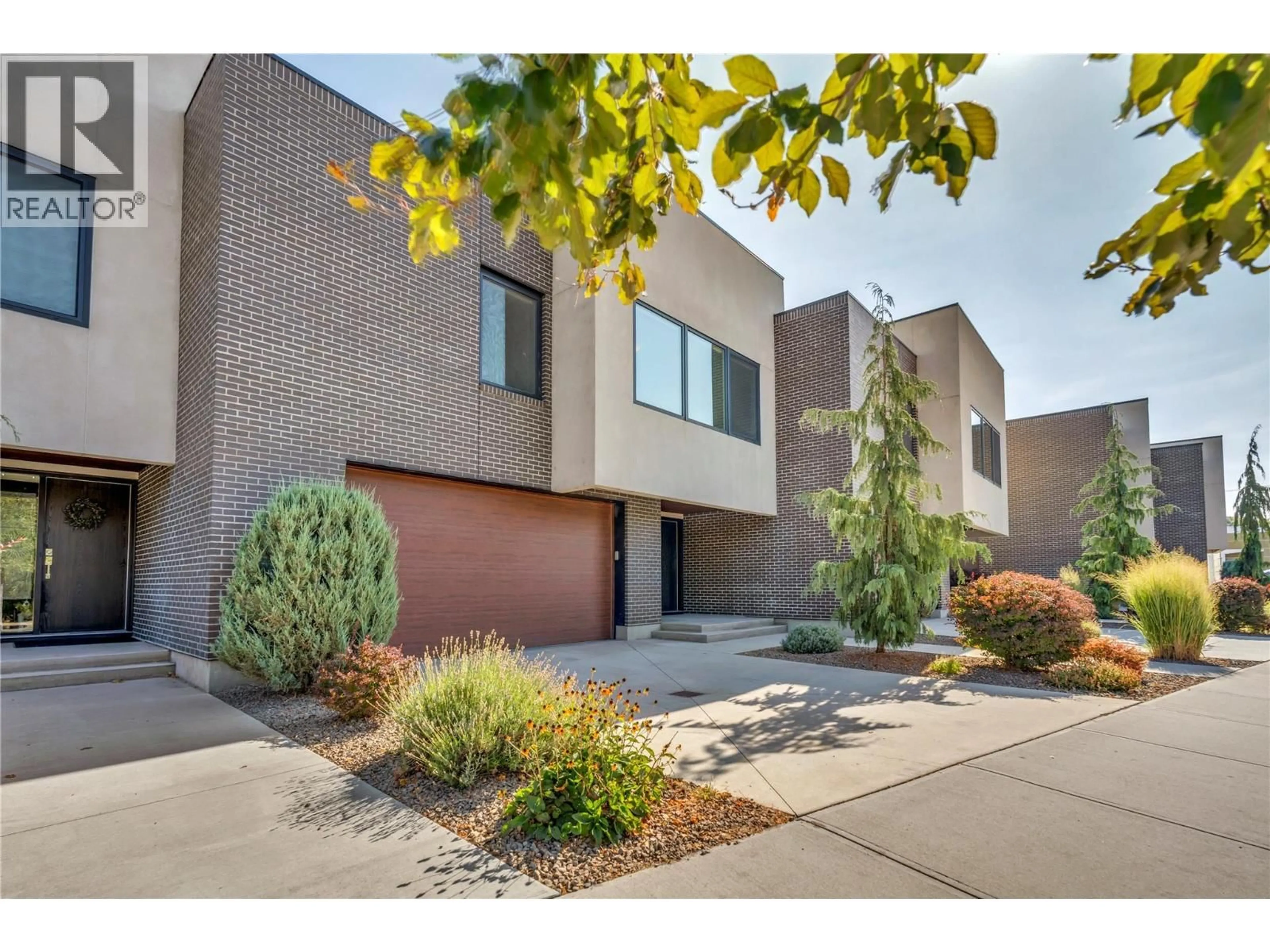 Home with brick exterior material, street for 102 - 166 POWER STREET, Penticton British Columbia V2A5W9