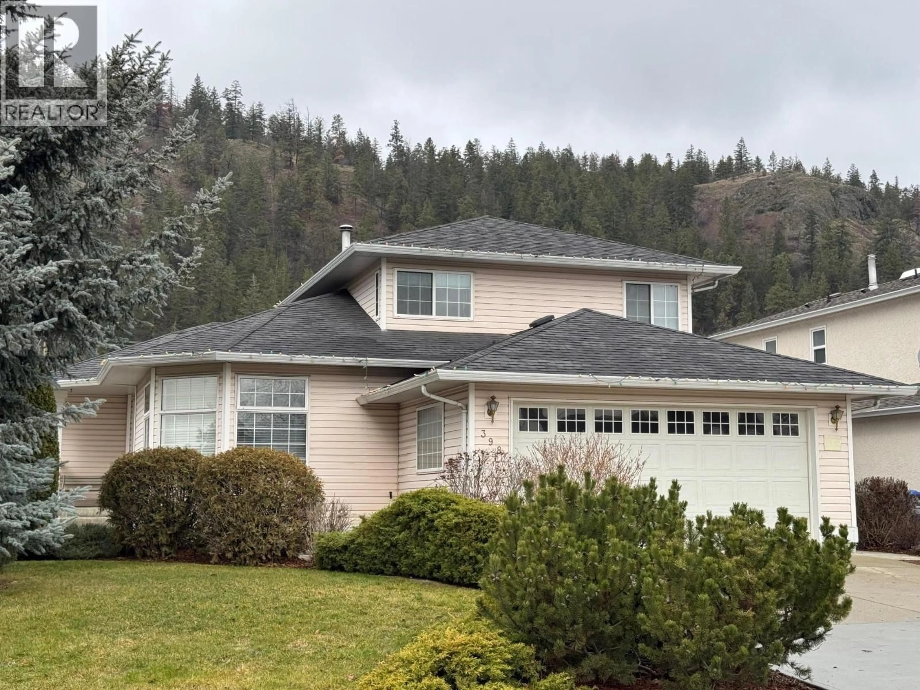 Home with vinyl exterior material, mountain view for 398 MCTAVISH ROAD, Kelowna British Columbia V1V1P1