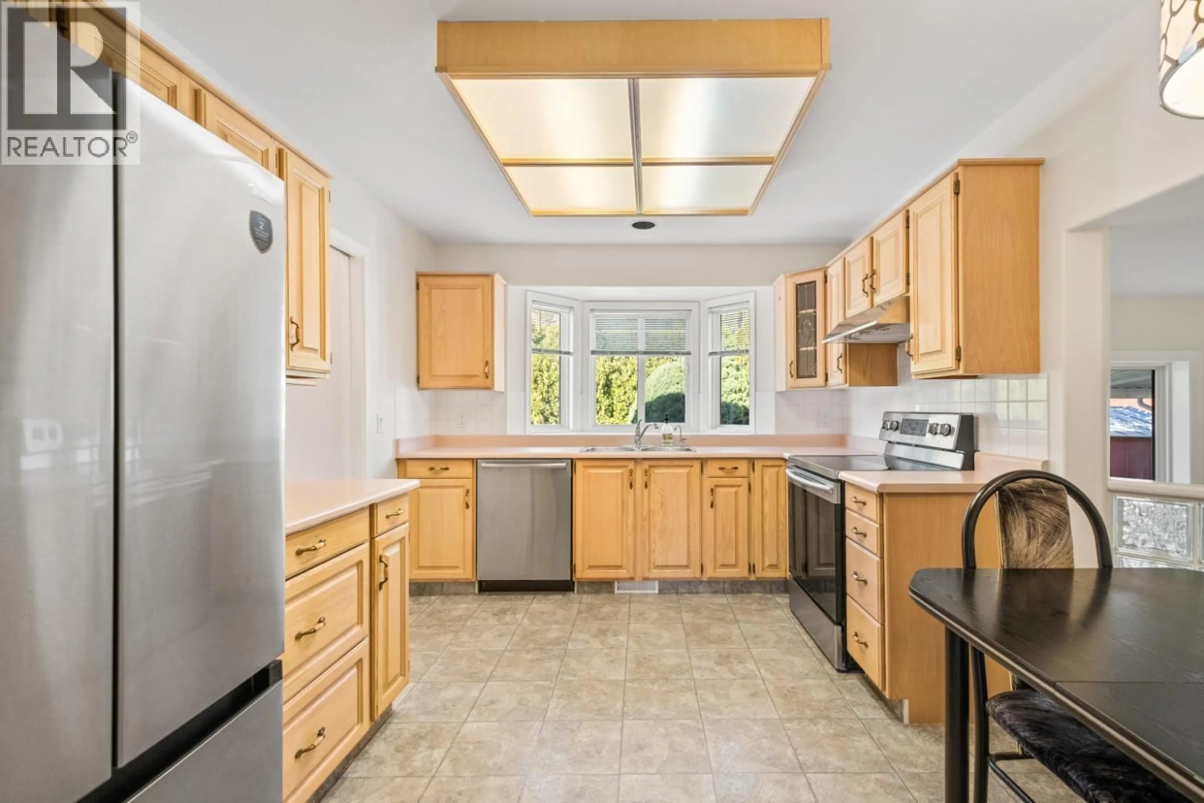 Standard kitchen, ceramic/tile floor for 398 MCTAVISH ROAD, Kelowna British Columbia V1V1P1