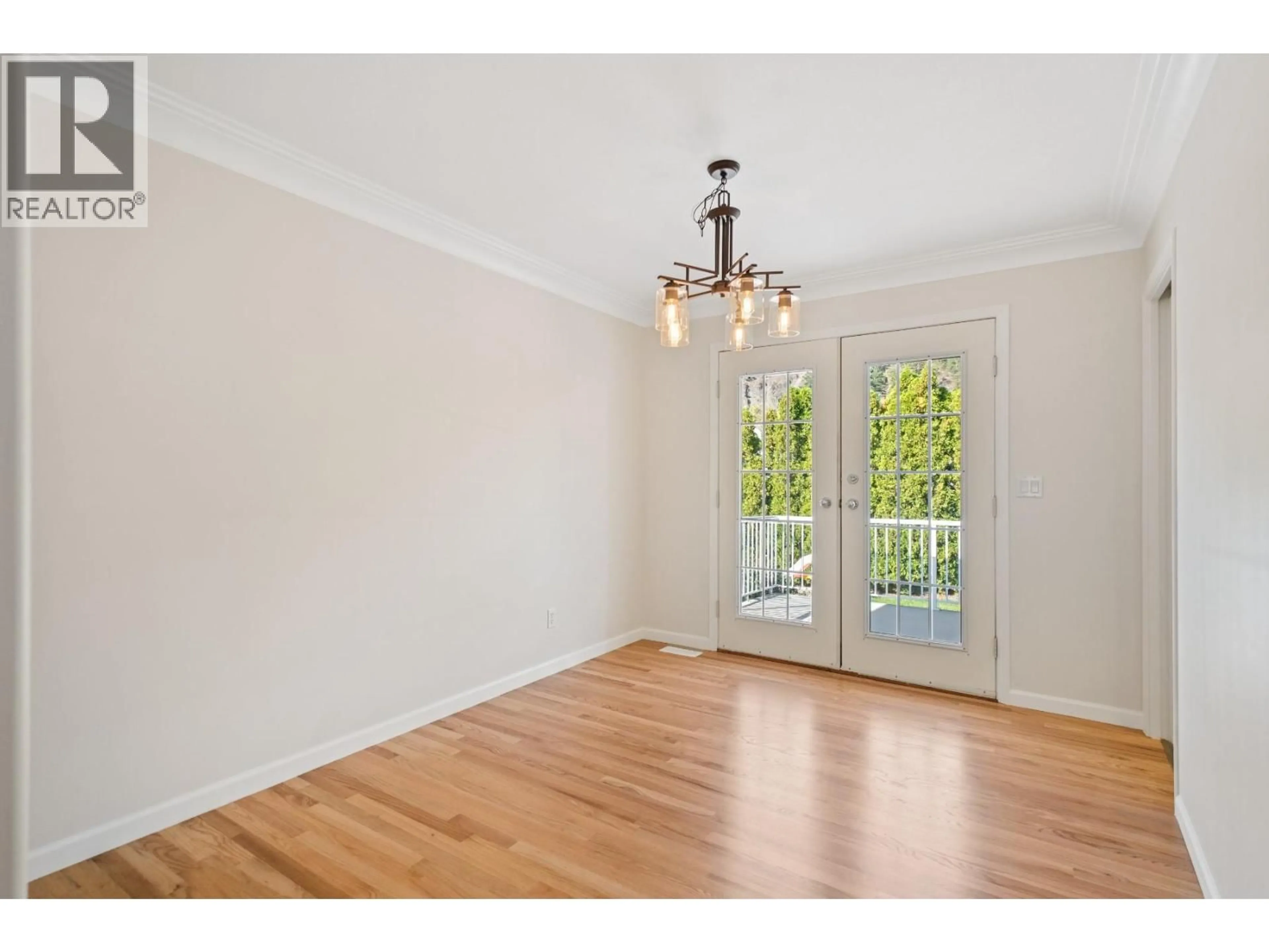 Dining room, wood/laminate floor for 398 MCTAVISH ROAD, Kelowna British Columbia V1V1P1