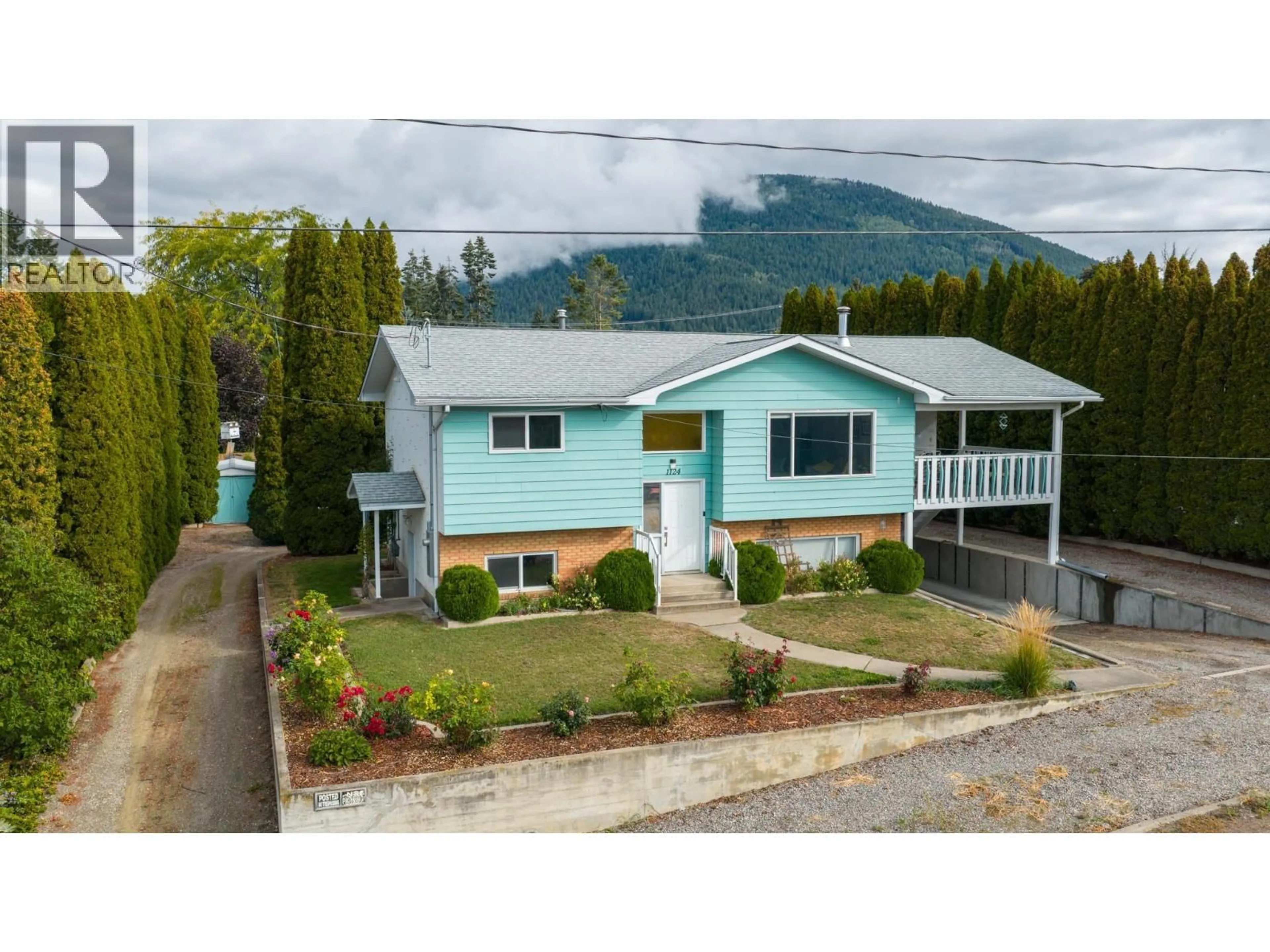 A pic from outside/outdoor area/front of a property/back of a property/a pic from drone, mountain view for 1124 ERICKSON STREET, Creston British Columbia V0B1G3