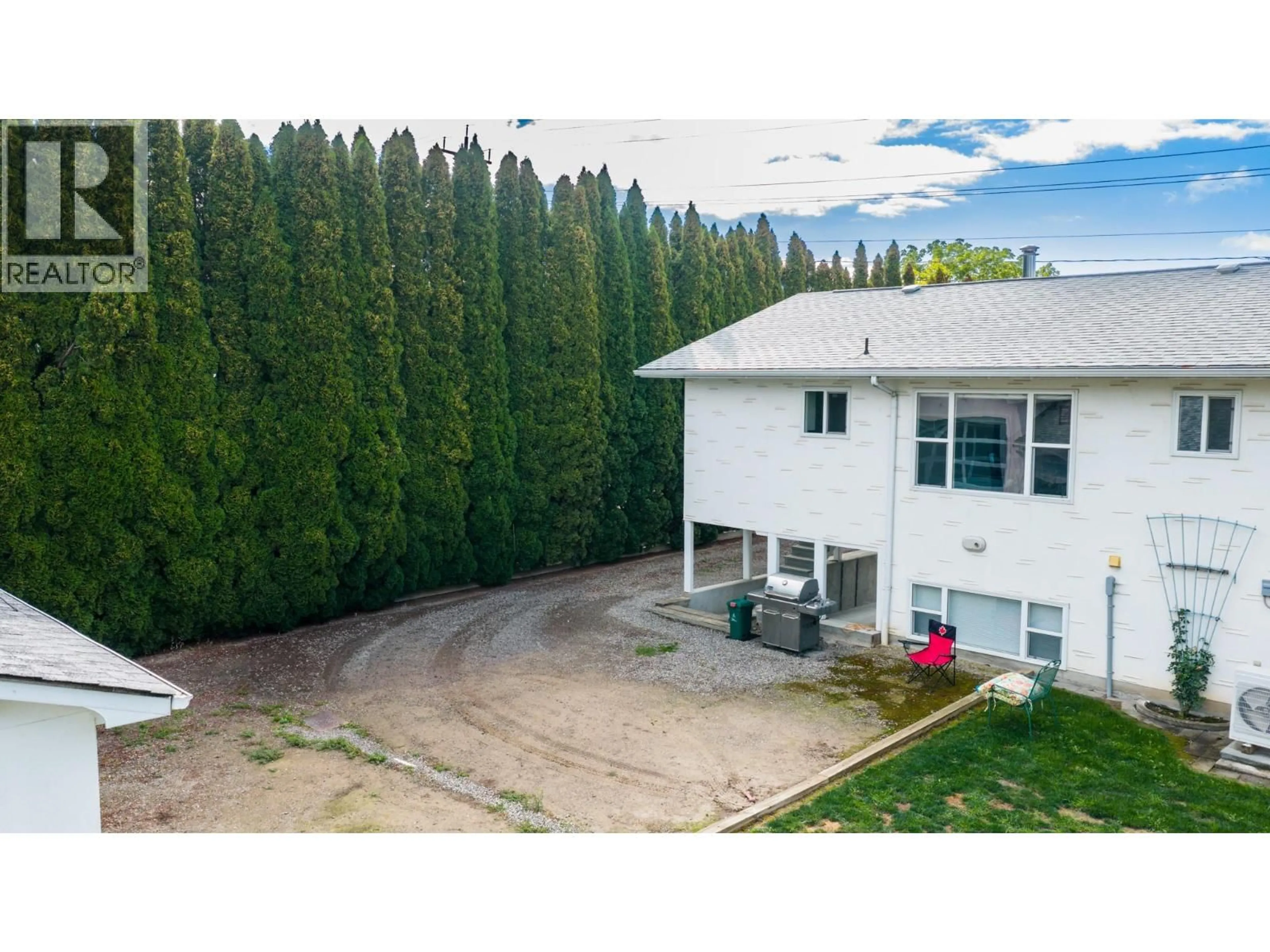 A pic from outside/outdoor area/front of a property/back of a property/a pic from drone, mountain view for 1124 ERICKSON STREET, Creston British Columbia V0B1G3