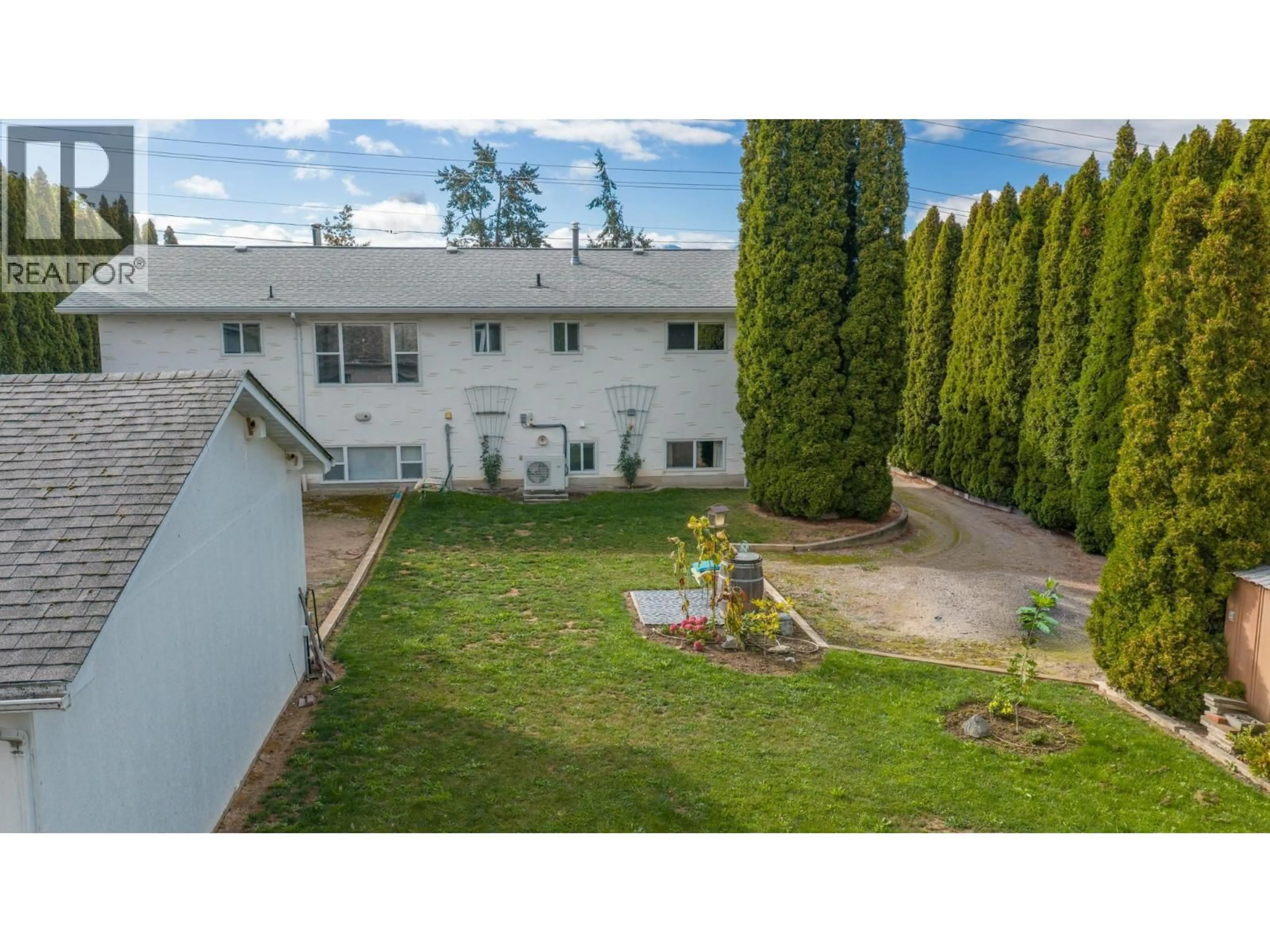A pic from outside/outdoor area/front of a property/back of a property/a pic from drone, mountain view for 1124 ERICKSON STREET, Creston British Columbia V0B1G3