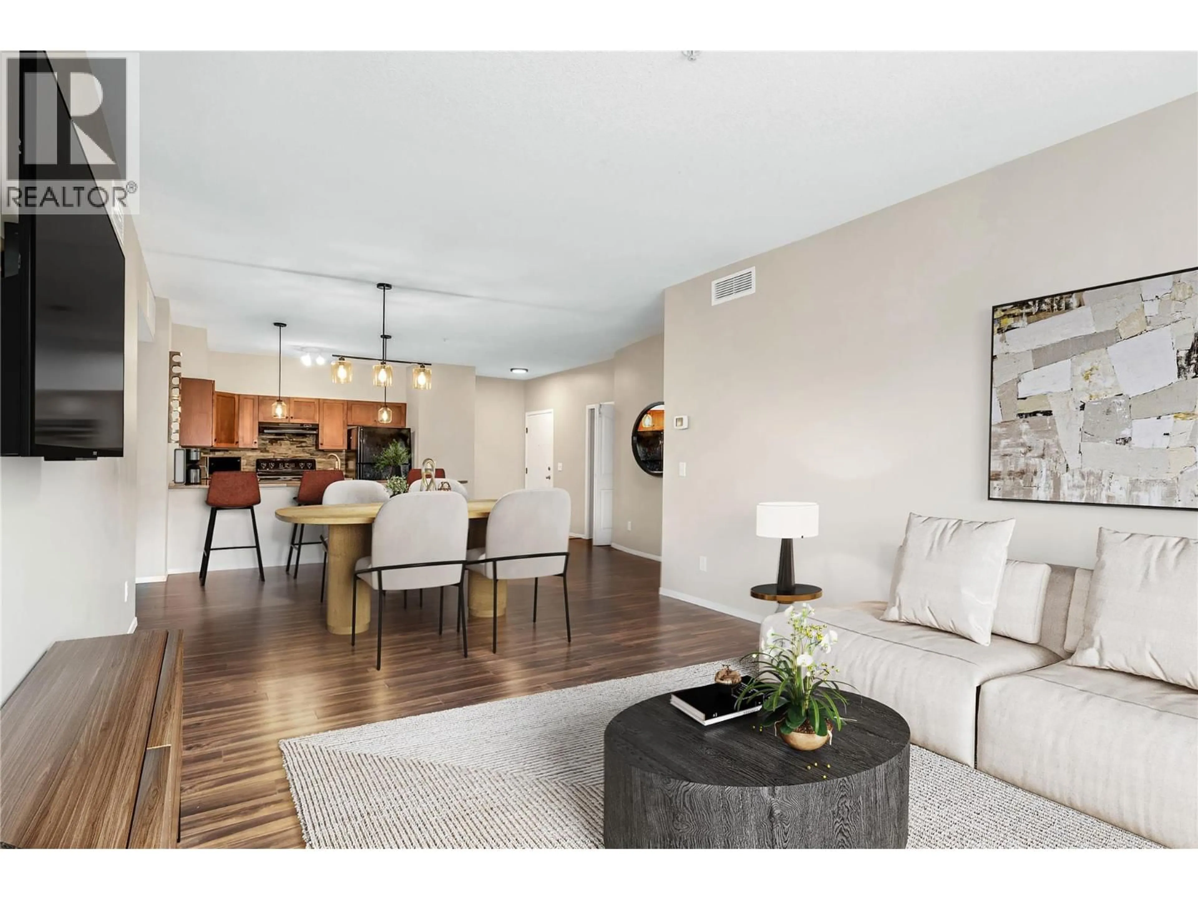 Living room with furniture, wood/laminate floor for 1102 - 3168 VIA CENTRALE OTHER, Kelowna British Columbia V1V2R6