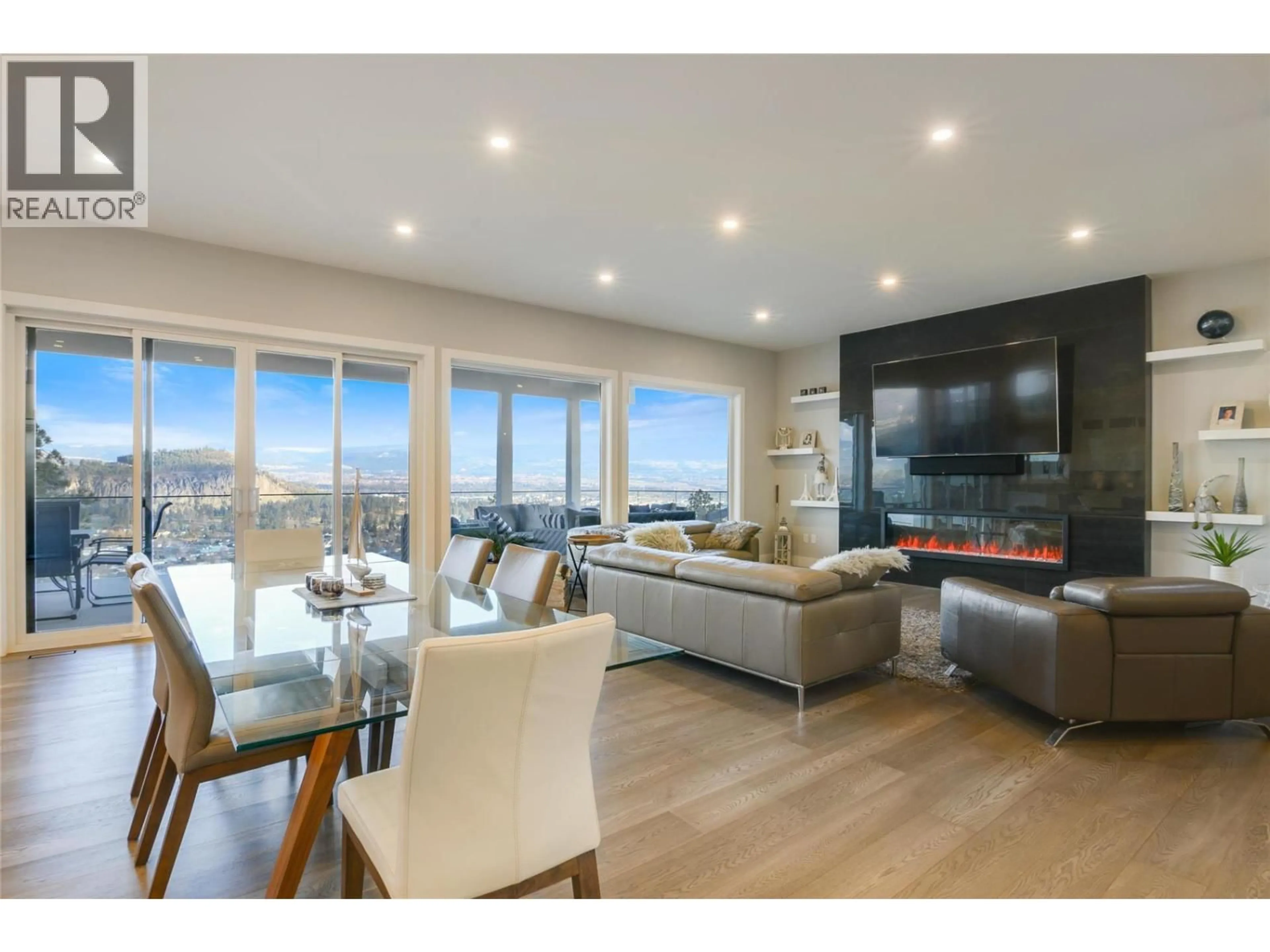 Living room with furniture, wood/laminate floor for 761 HIGHPOINTE LANE, Kelowna British Columbia V1V2Y1