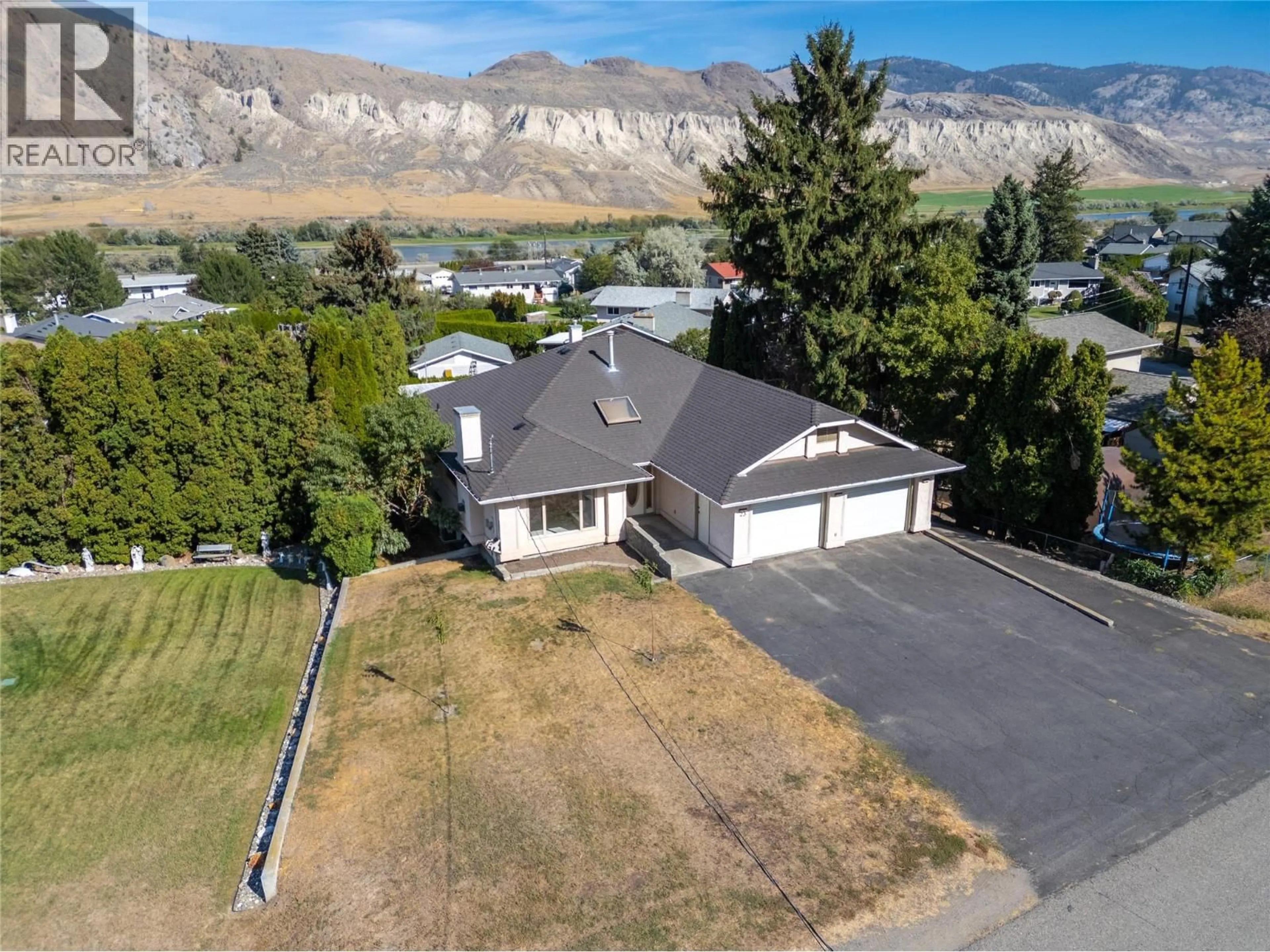 A pic from outside/outdoor area/front of a property/back of a property/a pic from drone, mountain view for 23 KELSO CRESCENT, Kamloops British Columbia V2C5A1
