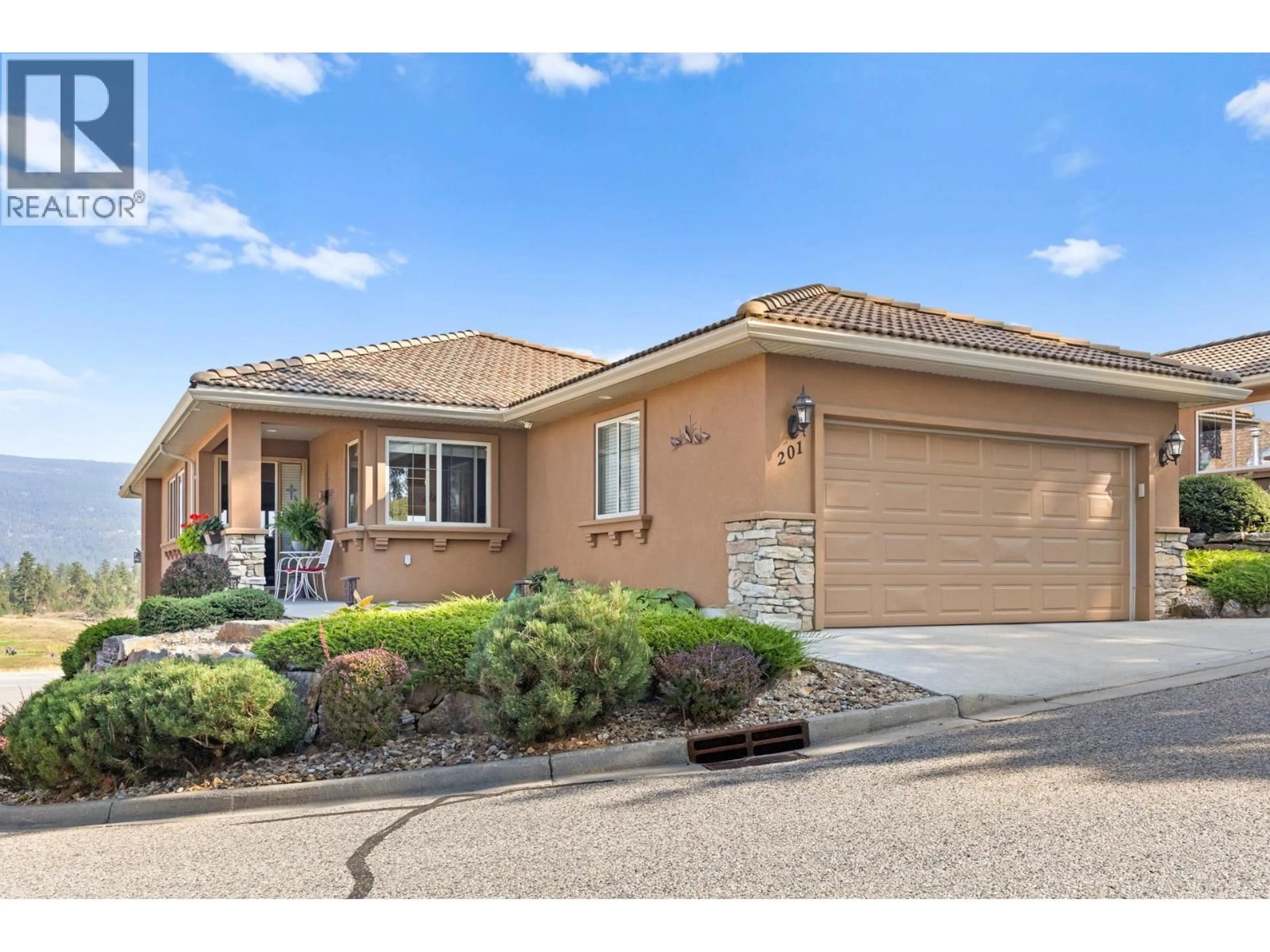 Home with brick exterior material, street for 201 - 2455 QUAIL RIDGE BOULEVARD, Kelowna British Columbia V1V2S8