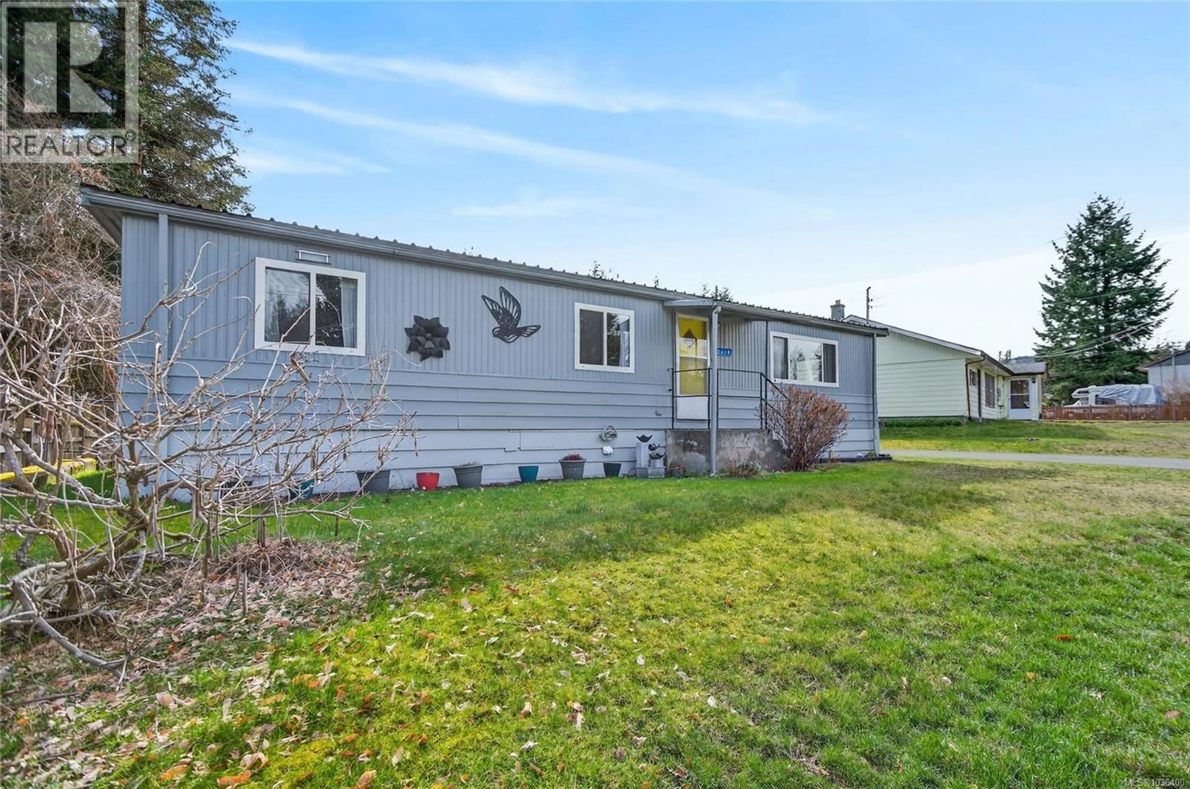 Home with vinyl exterior material, street for 2619 ULVERSTON AVENUE, Cumberland British Columbia V0R1S0