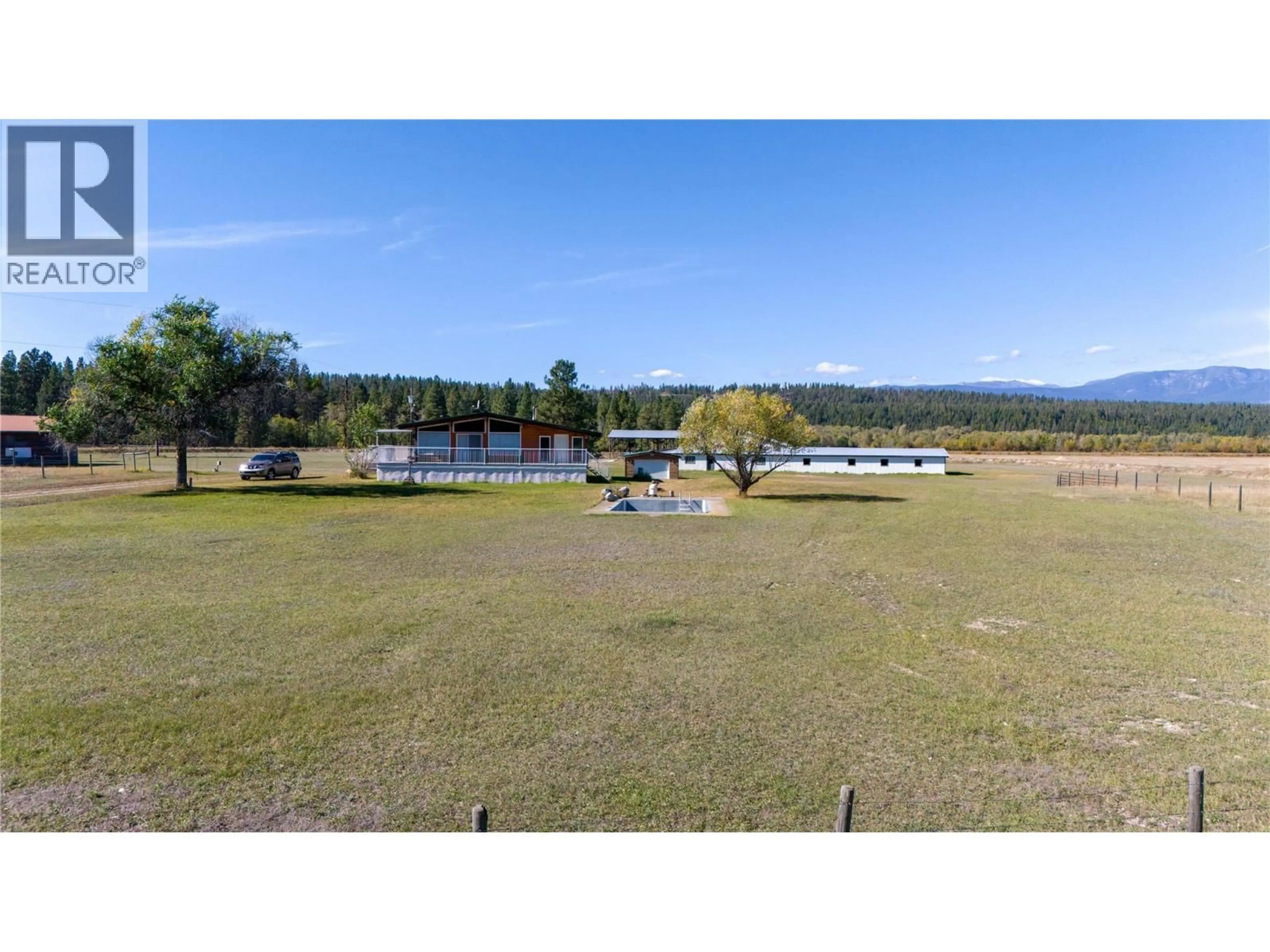 A pic from outside/outdoor area/front of a property/back of a property/a pic from drone, water/lake/river/ocean view for 7055 93/95 HIGHWAY, Wasa British Columbia V0B2K0