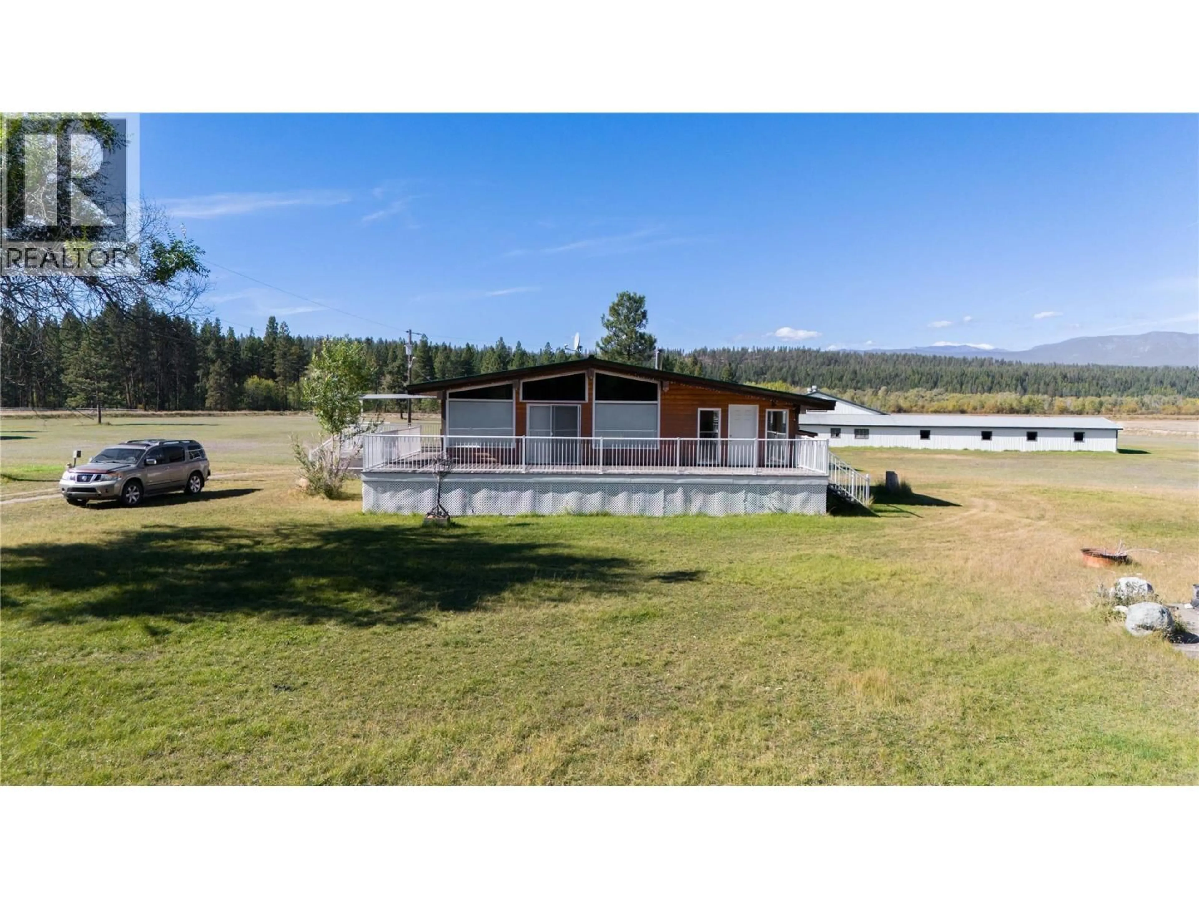 A pic from outside/outdoor area/front of a property/back of a property/a pic from drone, water/lake/river/ocean view for 7055 93/95 HIGHWAY, Wasa British Columbia V0B2K0