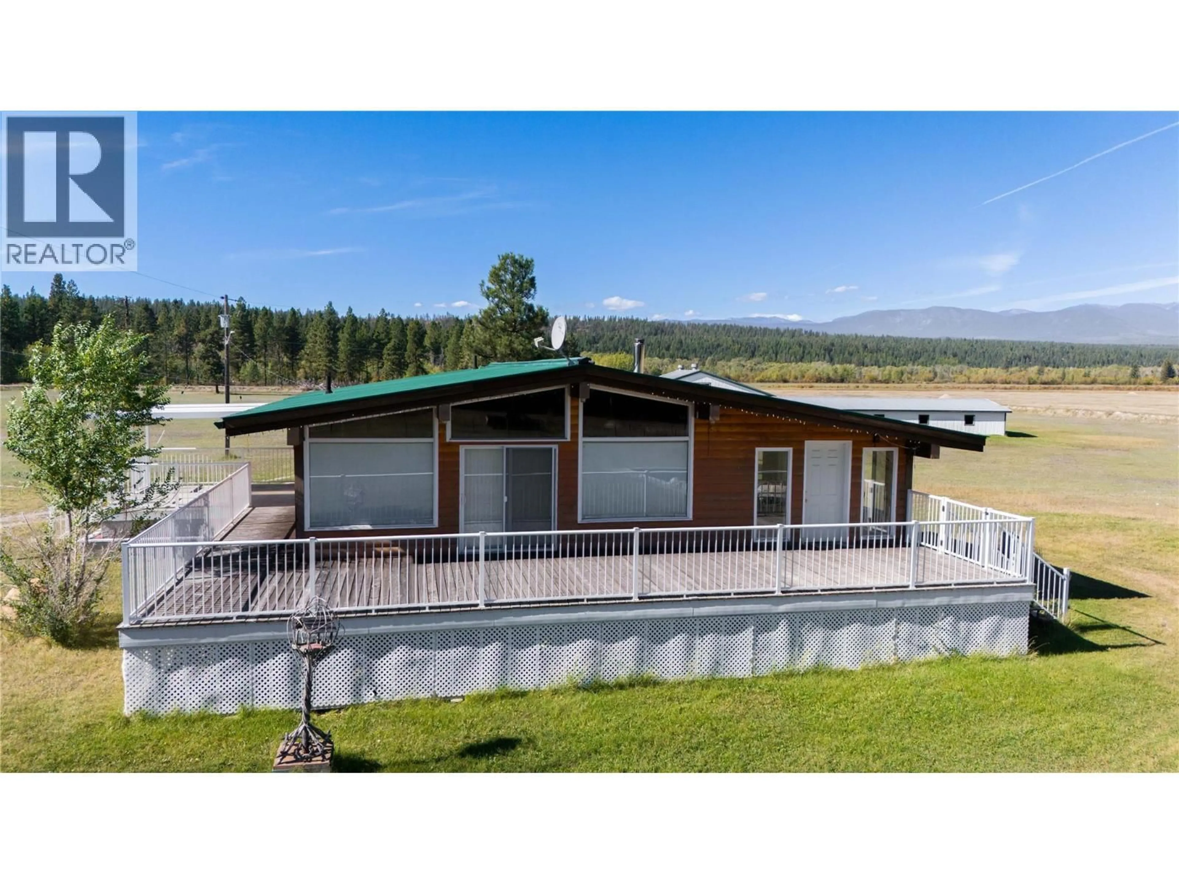 A pic from outside/outdoor area/front of a property/back of a property/a pic from drone, mountain view for 7055 93/95 HIGHWAY, Wasa British Columbia V0B2K0