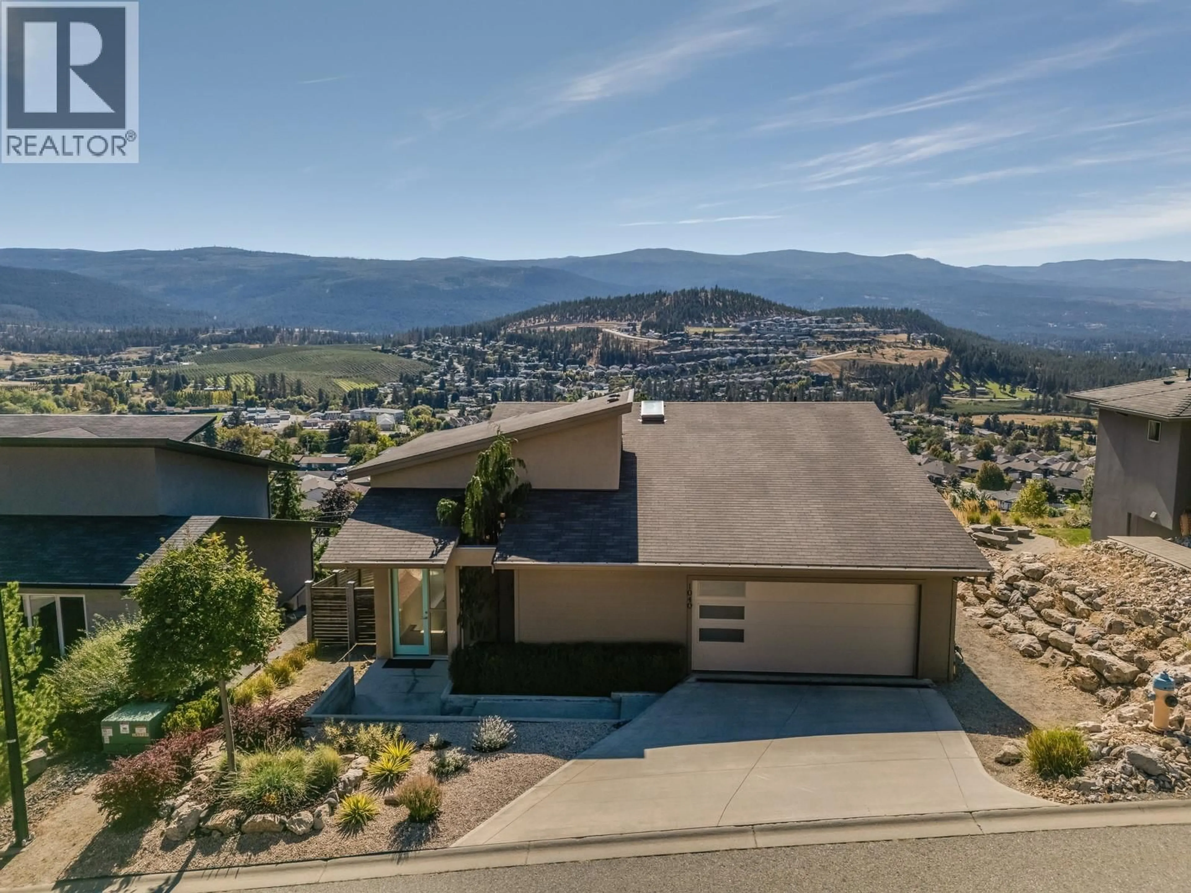 A pic from outside/outdoor area/front of a property/back of a property/a pic from drone, mountain view for 1040 HENDERSON DRIVE, Kelowna British Columbia V1P1S5