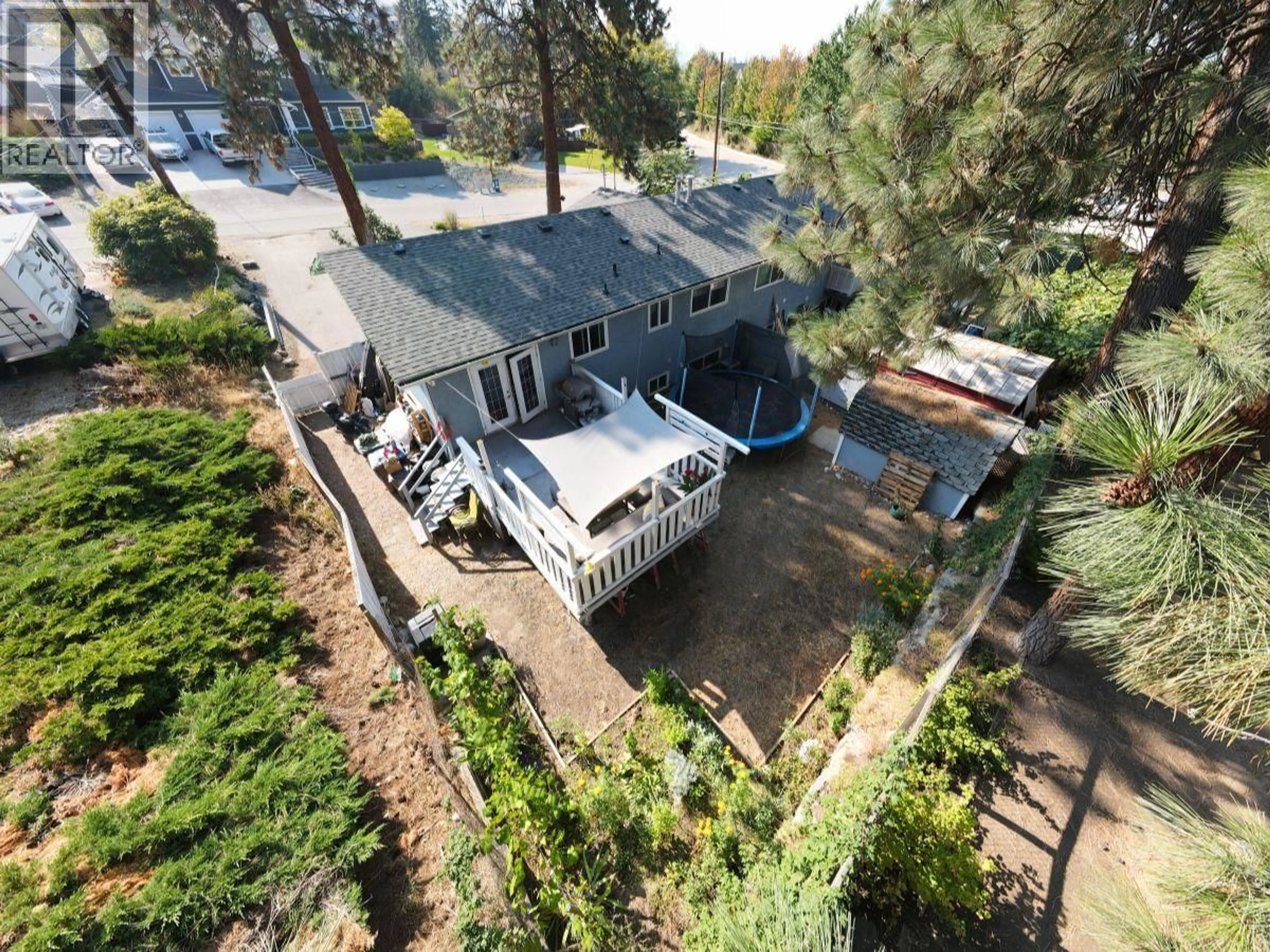 A pic from outside/outdoor area/front of a property/back of a property/a pic from drone, unknown for 488 STANLEY CRESCENT, Kelowna British Columbia V1W4L7