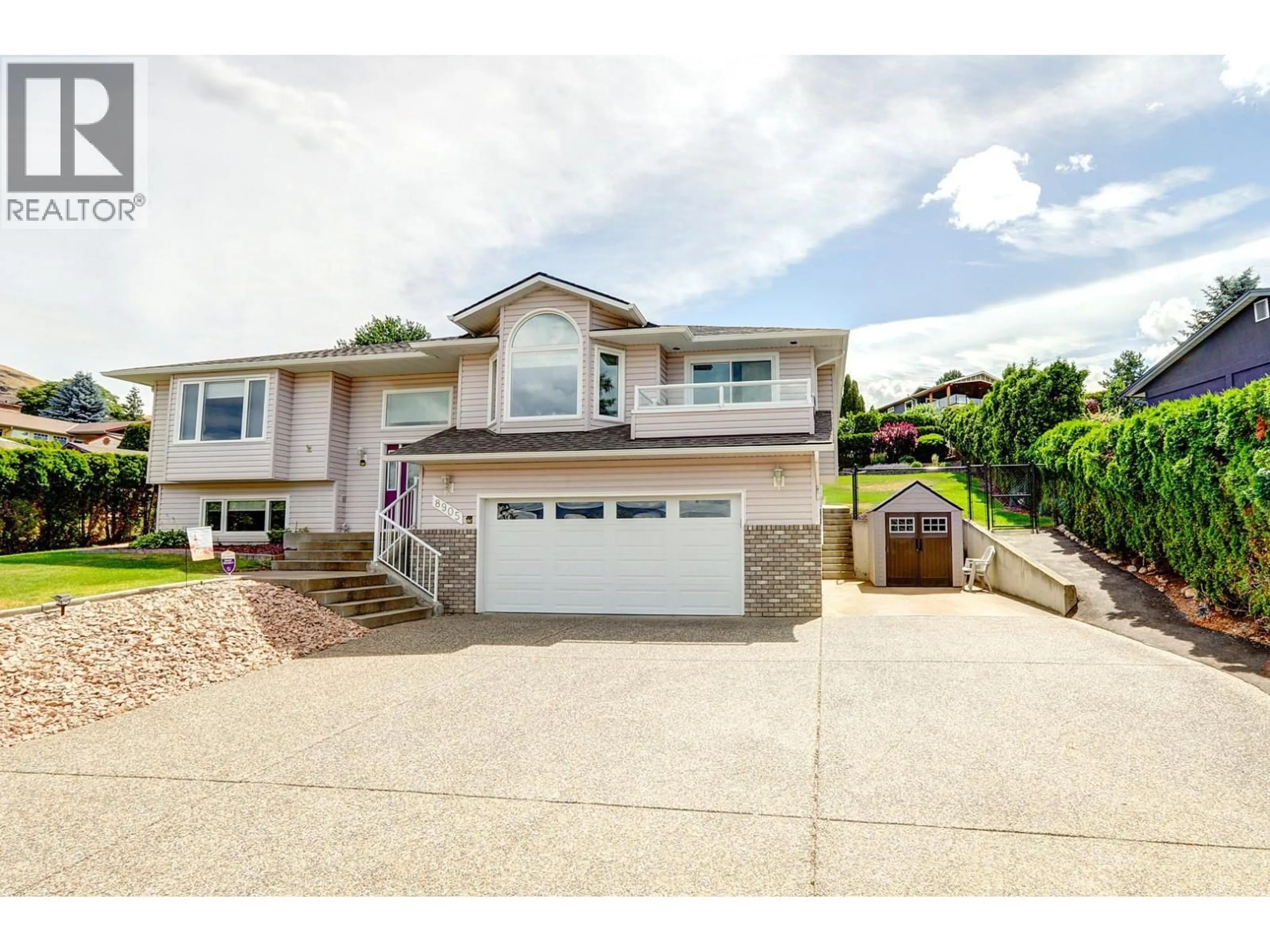 Home with vinyl exterior material, street for 8905 ORCHARD RIDGE DRIVE, Coldstream British Columbia V1B1Z7